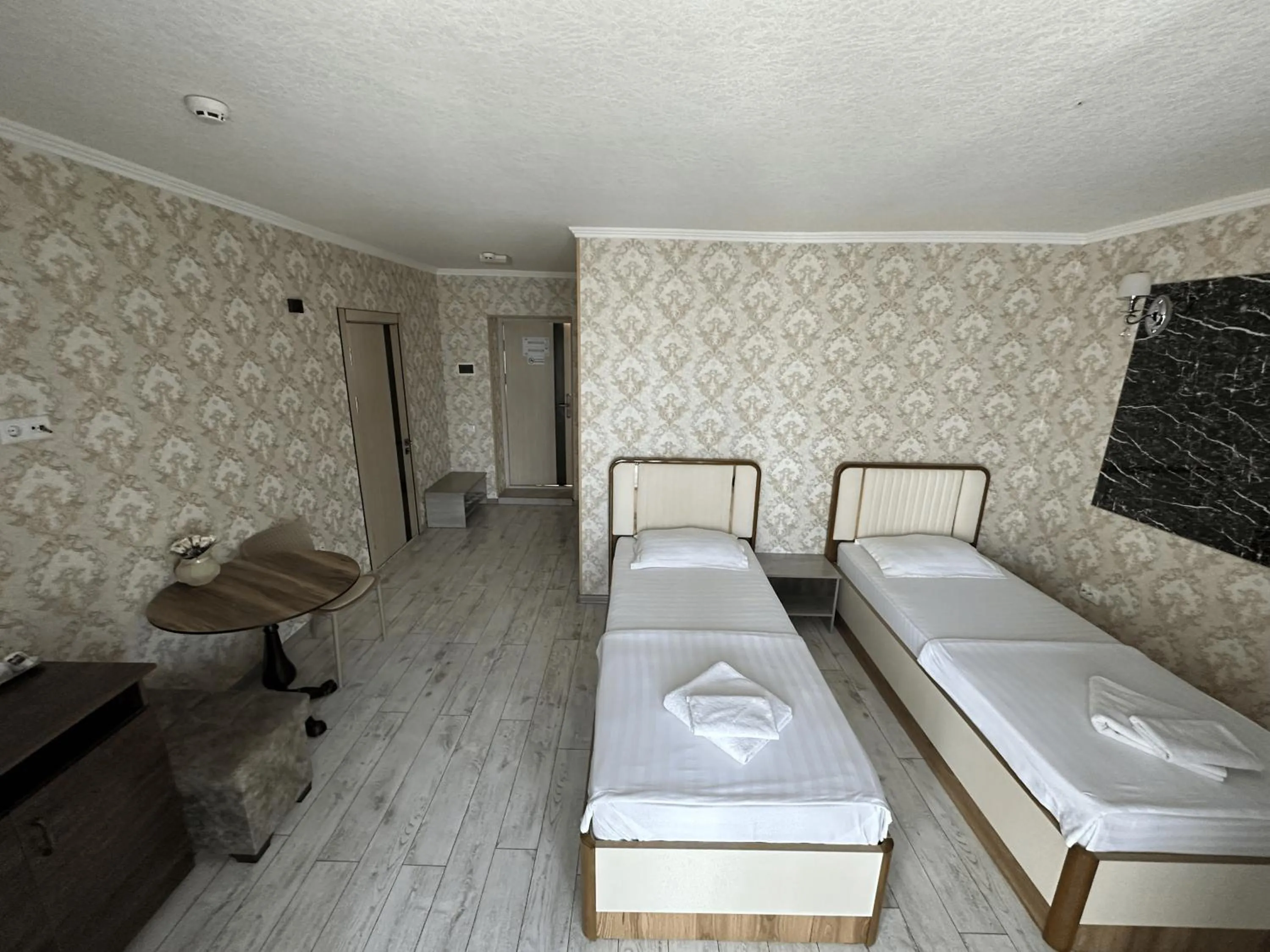 Bed in Artist Regency Hotel