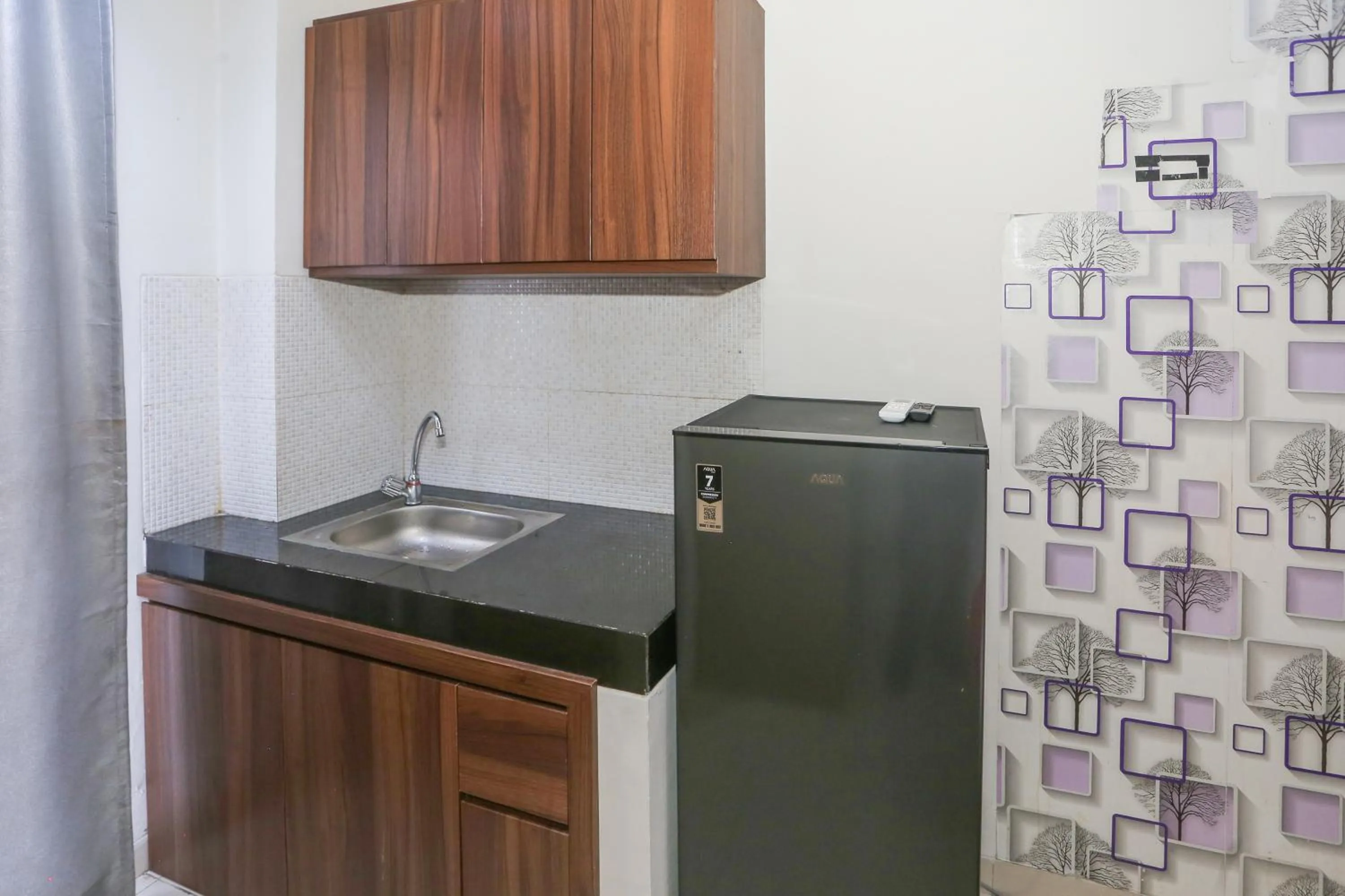 Kitchen or kitchenette in OYO 93948 Bunda Rachma Rooms