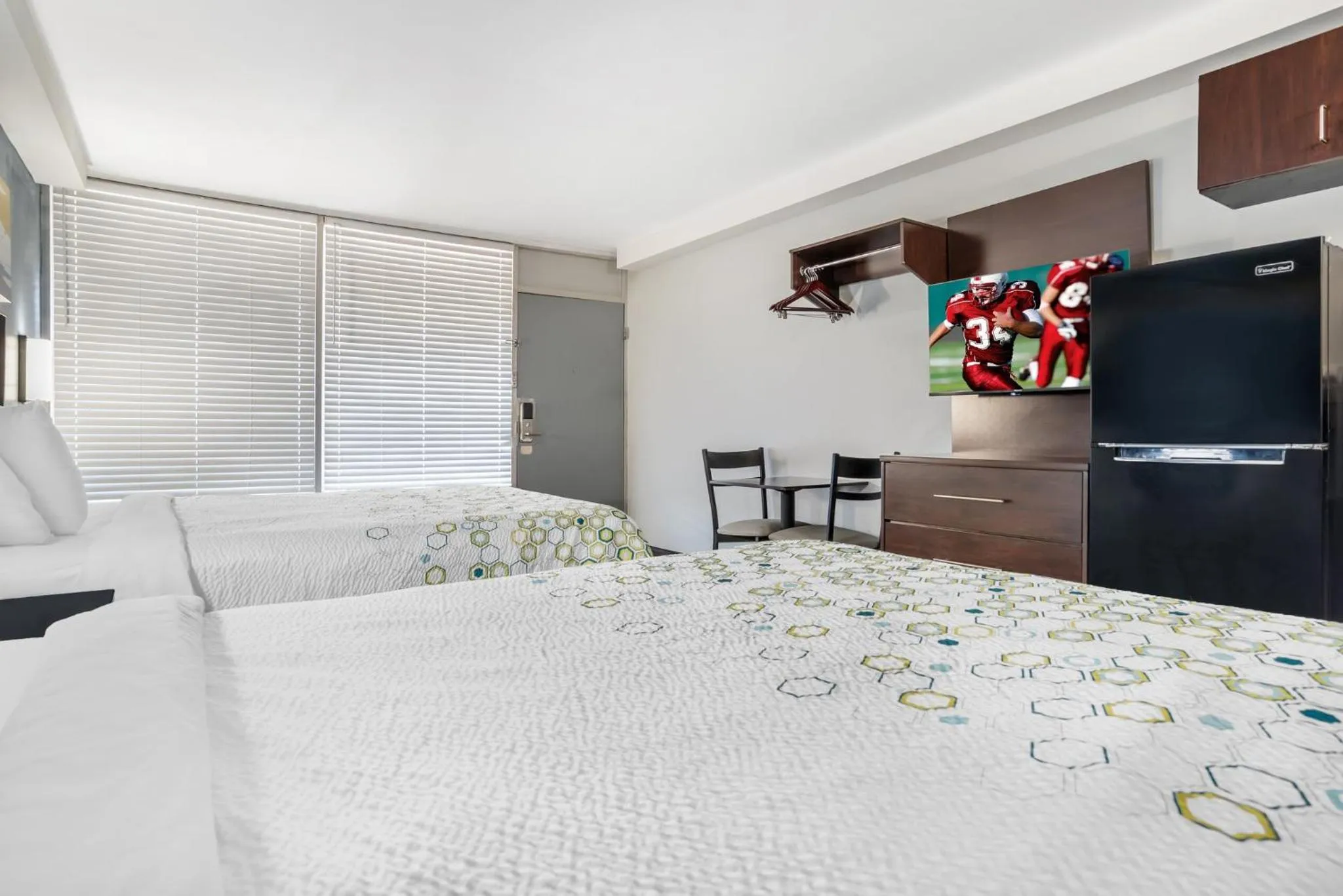 Bedroom, Bed in HomeTowne Studios by Red Roof Montgomery - Midtown