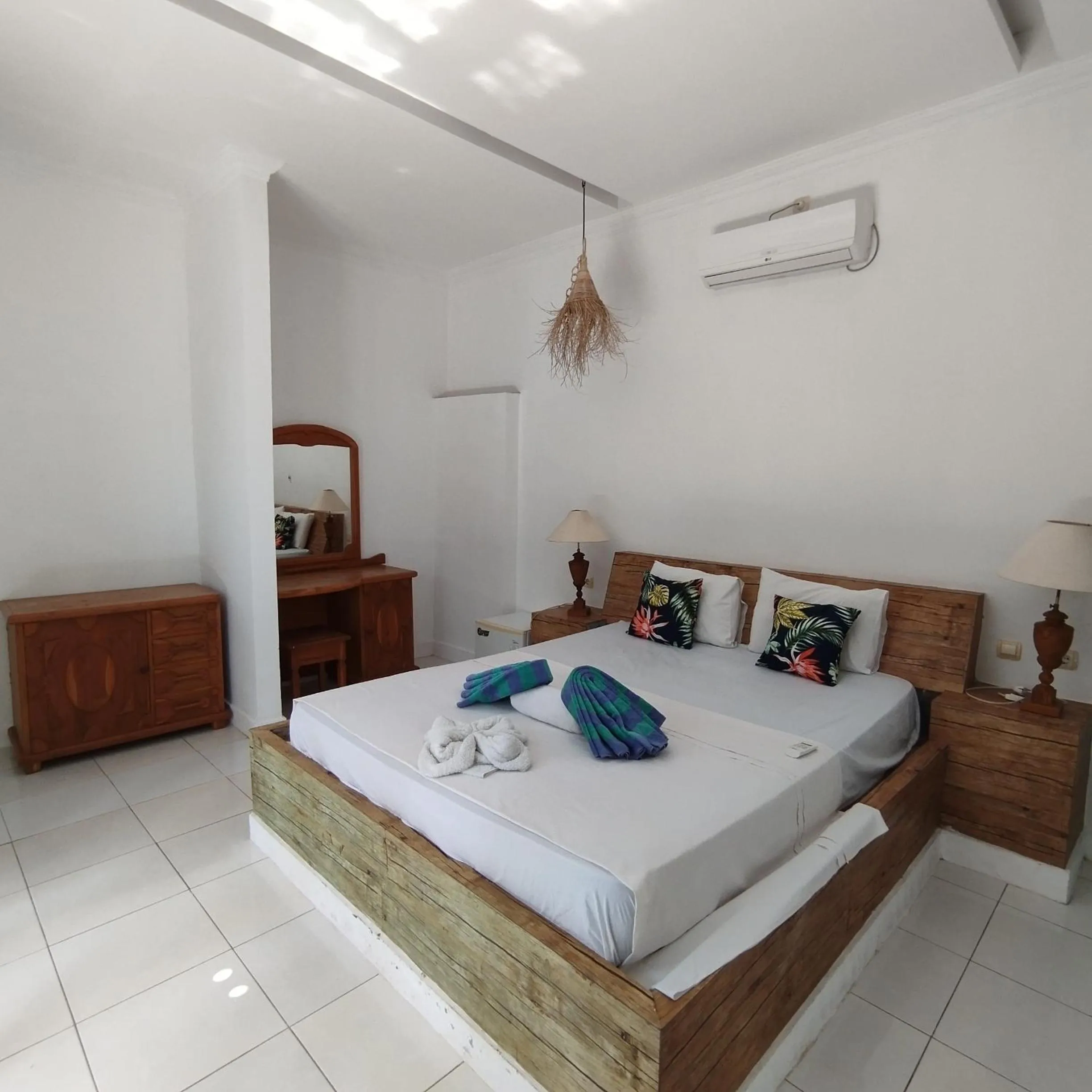 Bed in Palm Trees Villas