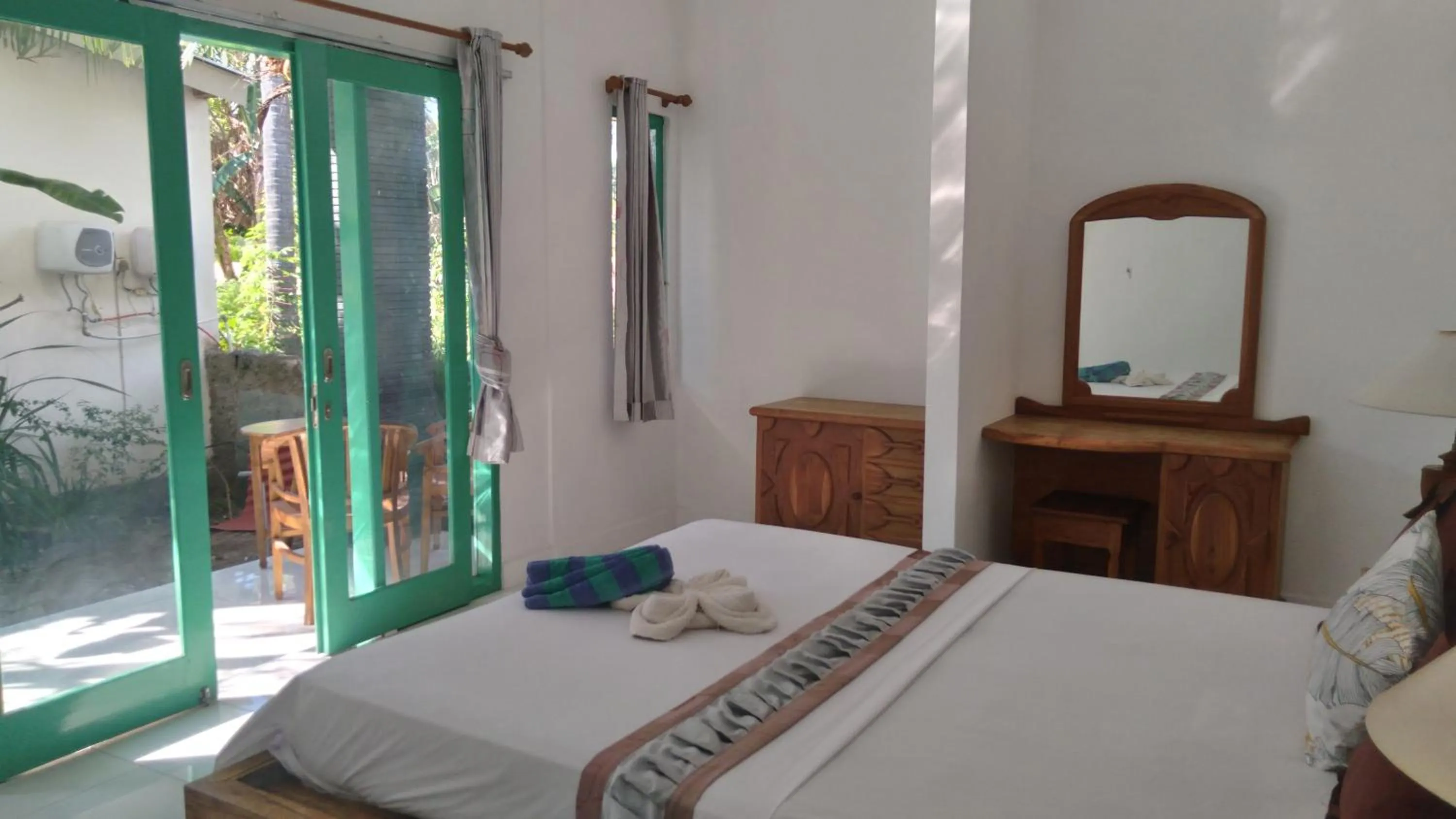 Bed in Palm Trees Villas