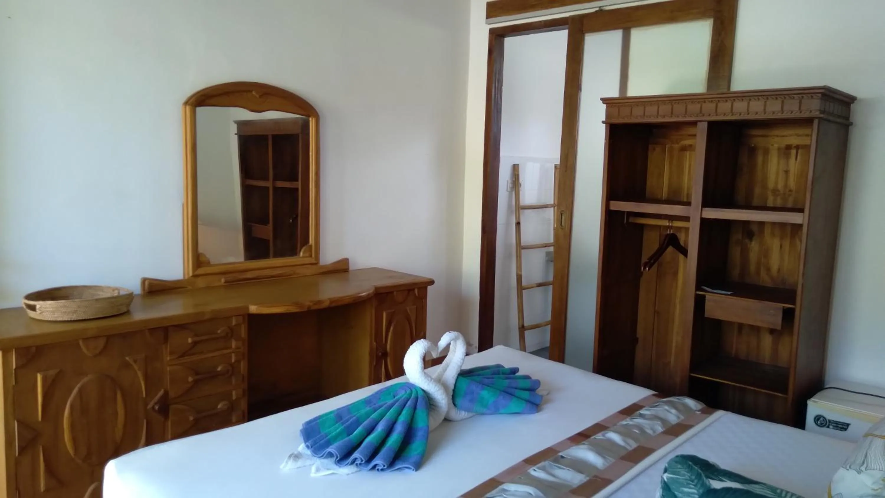 Bed in Palm Trees Villas