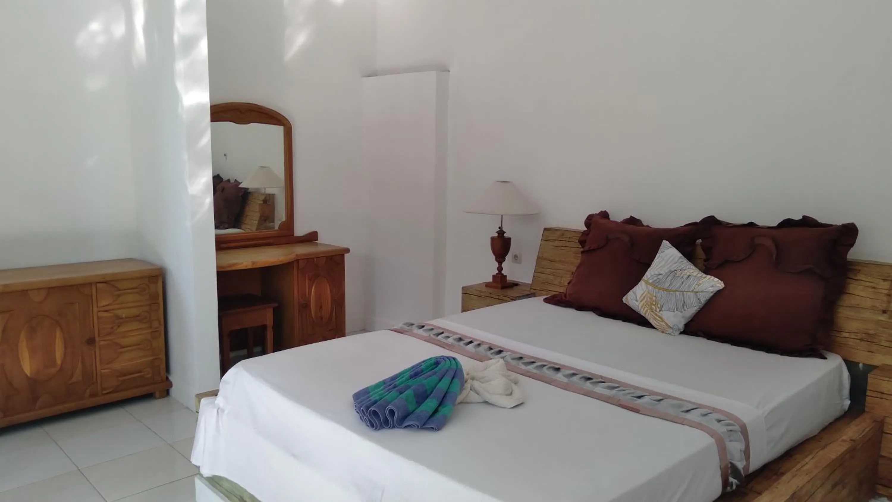 Bed in Palm Trees Villas