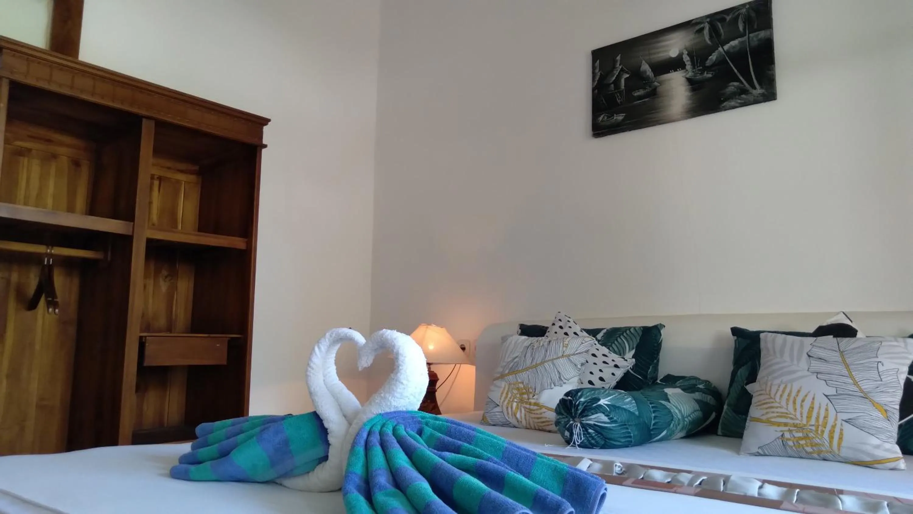 Bed in Palm Trees Villas