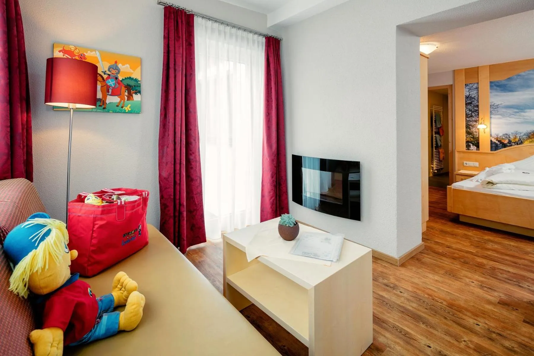 Living room, Bed in Kinderhotel Laderhof