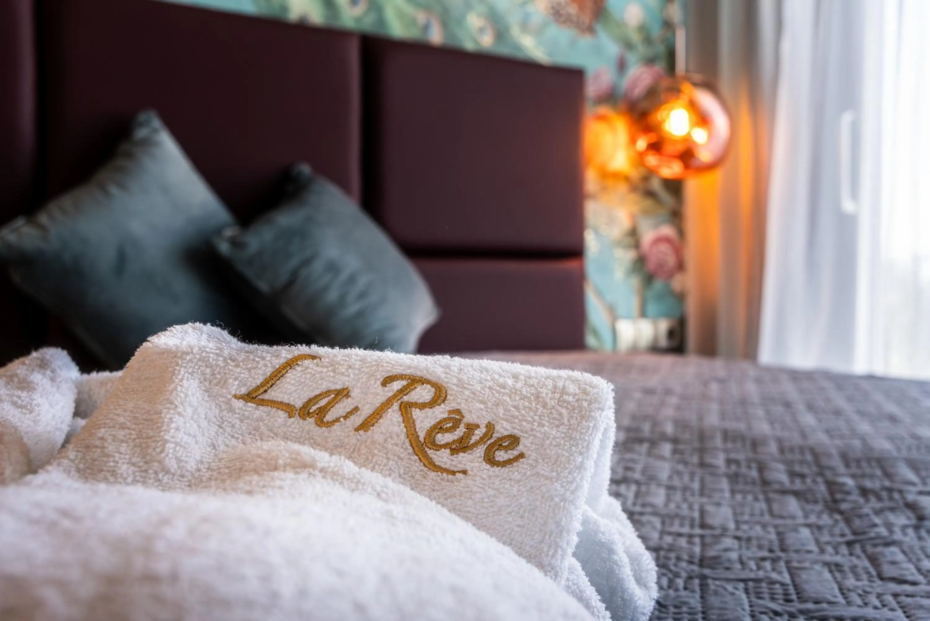 Bed in La Rêve Luxury Apartments with Private Jacuzzi