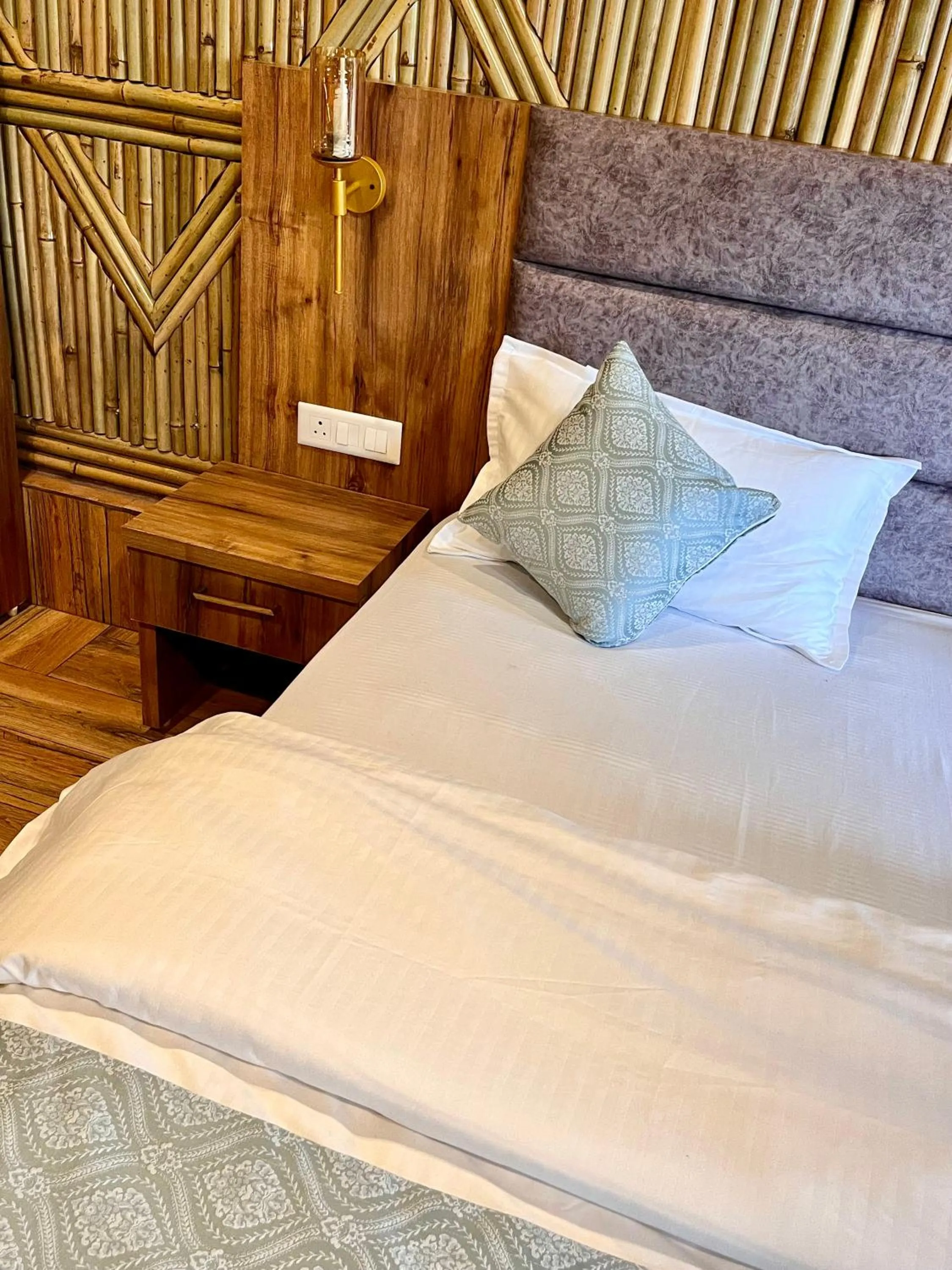 Bed in Bamboo Garden Cottages and Cafe