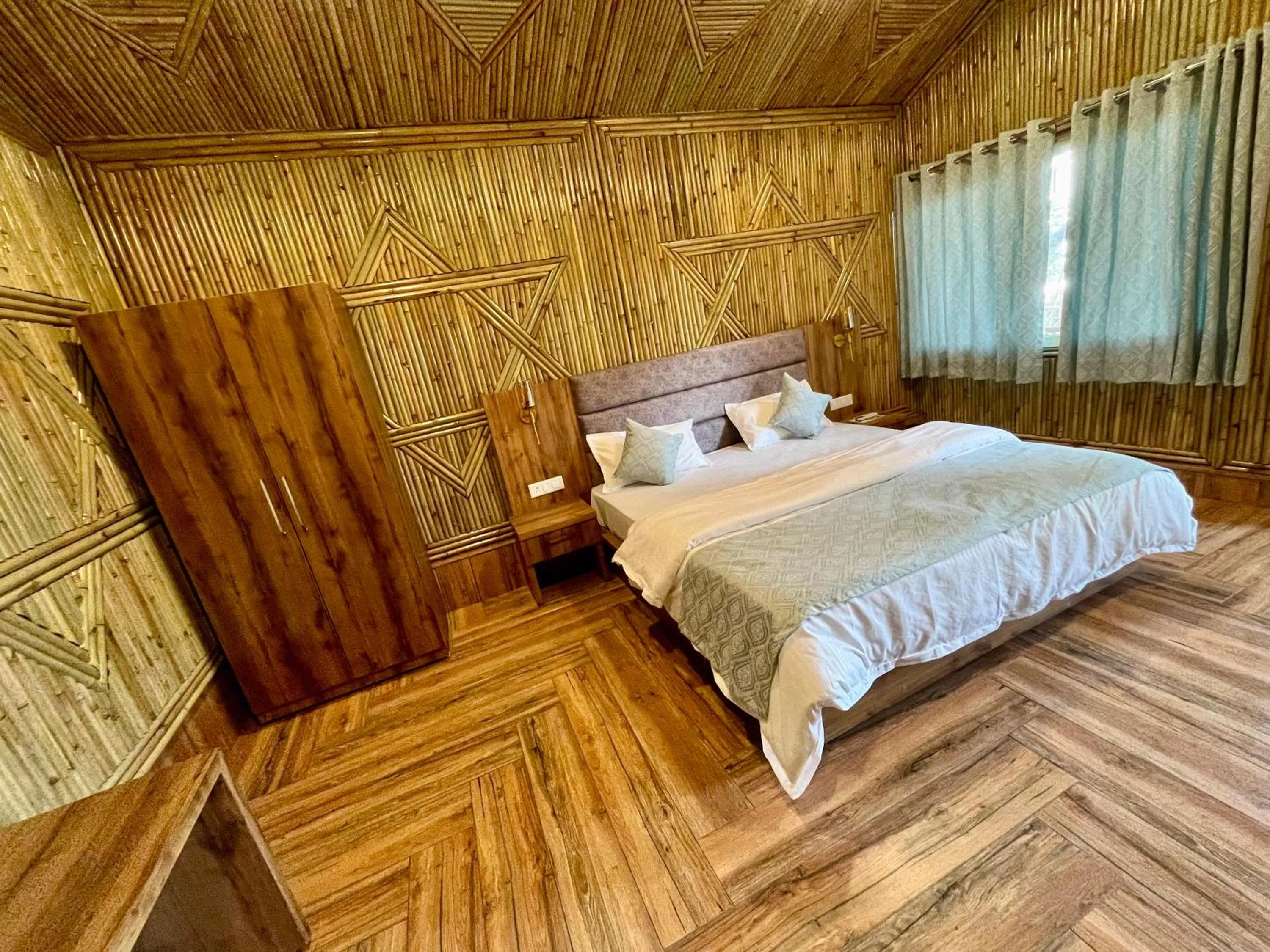 Bed in Bamboo Garden Cottages and Cafe