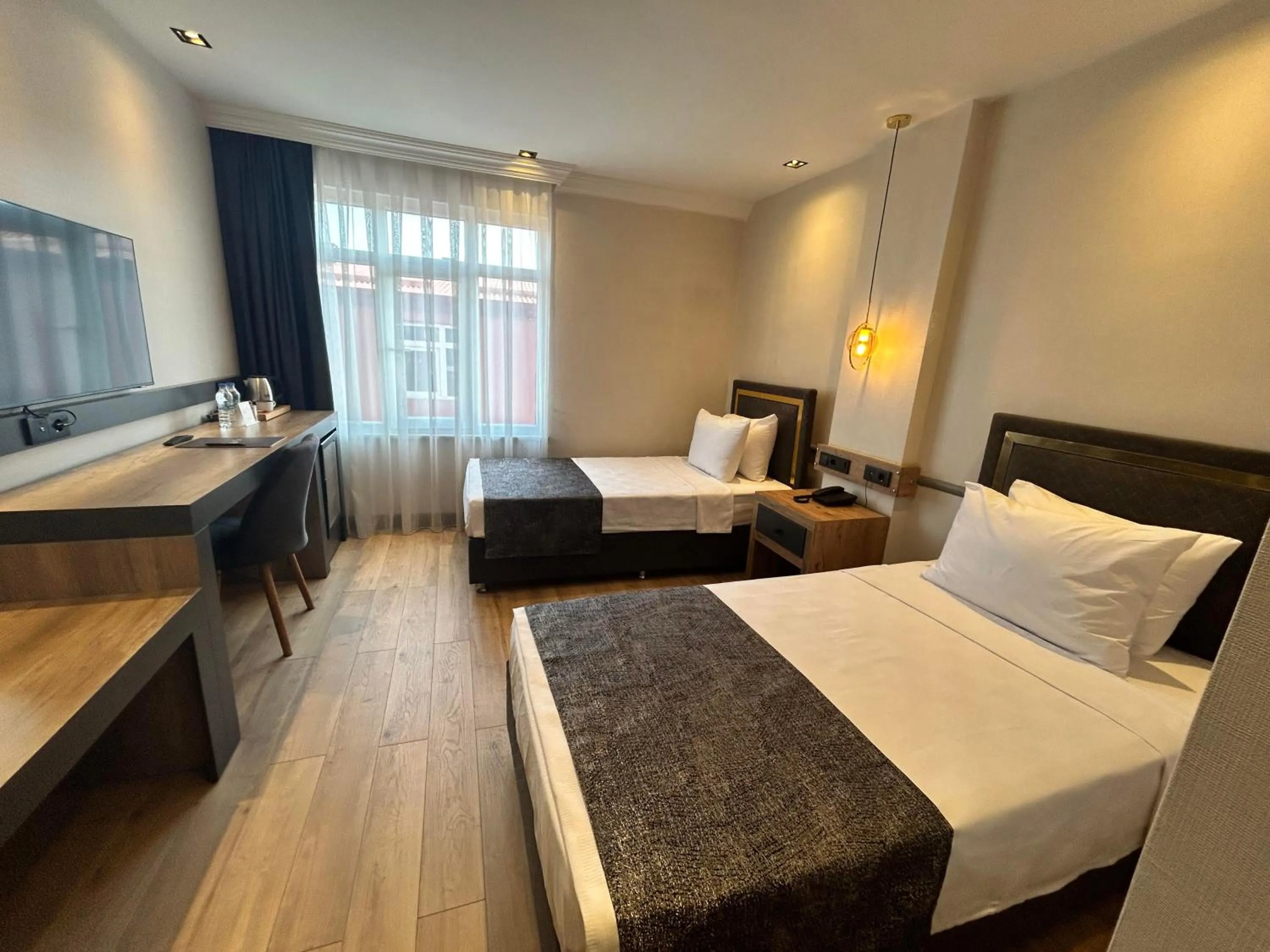 Bed in AYATOURE HOTEL