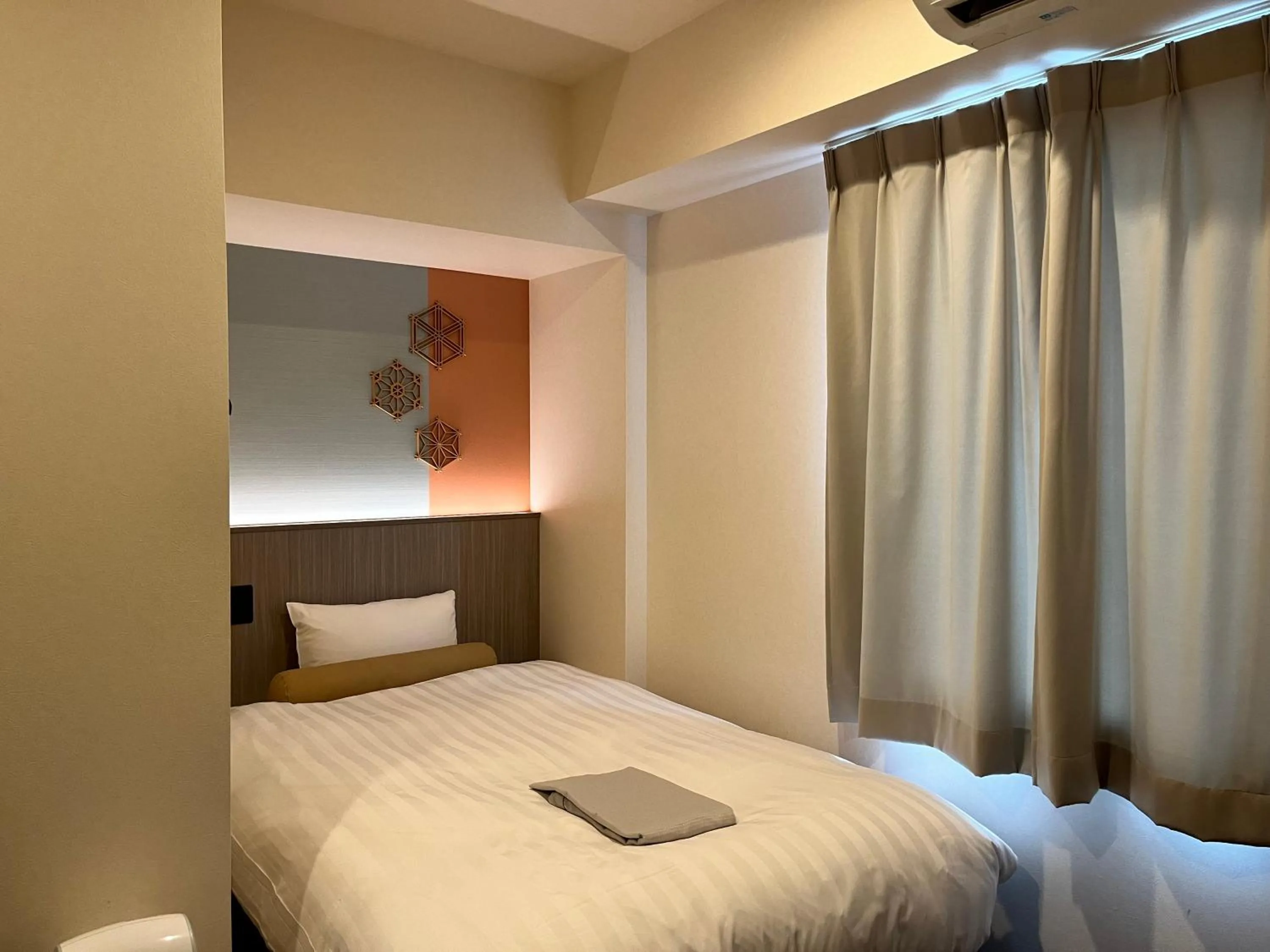 Bed in Hotel Japanesque Kyoto Station ZEQUU