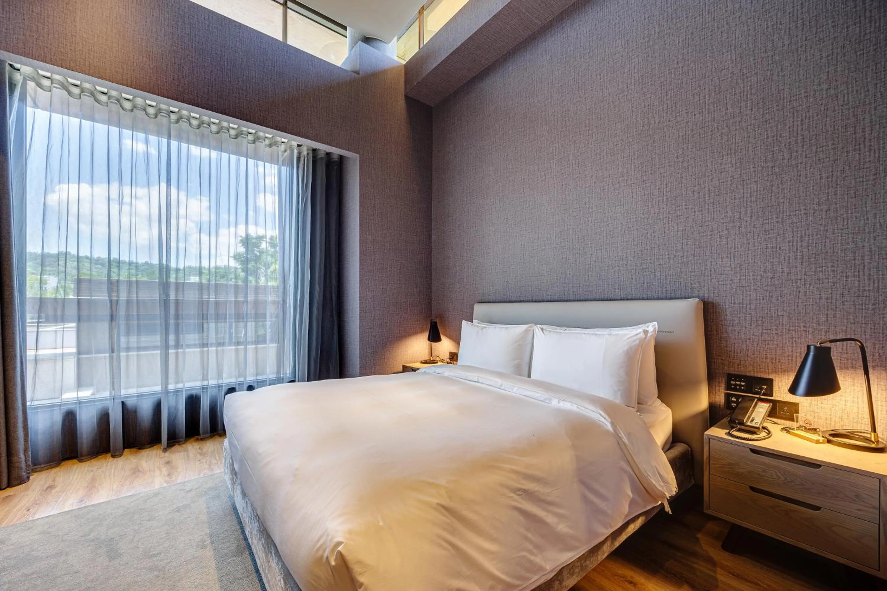 Bed in Boutech Wuri Village Hotel