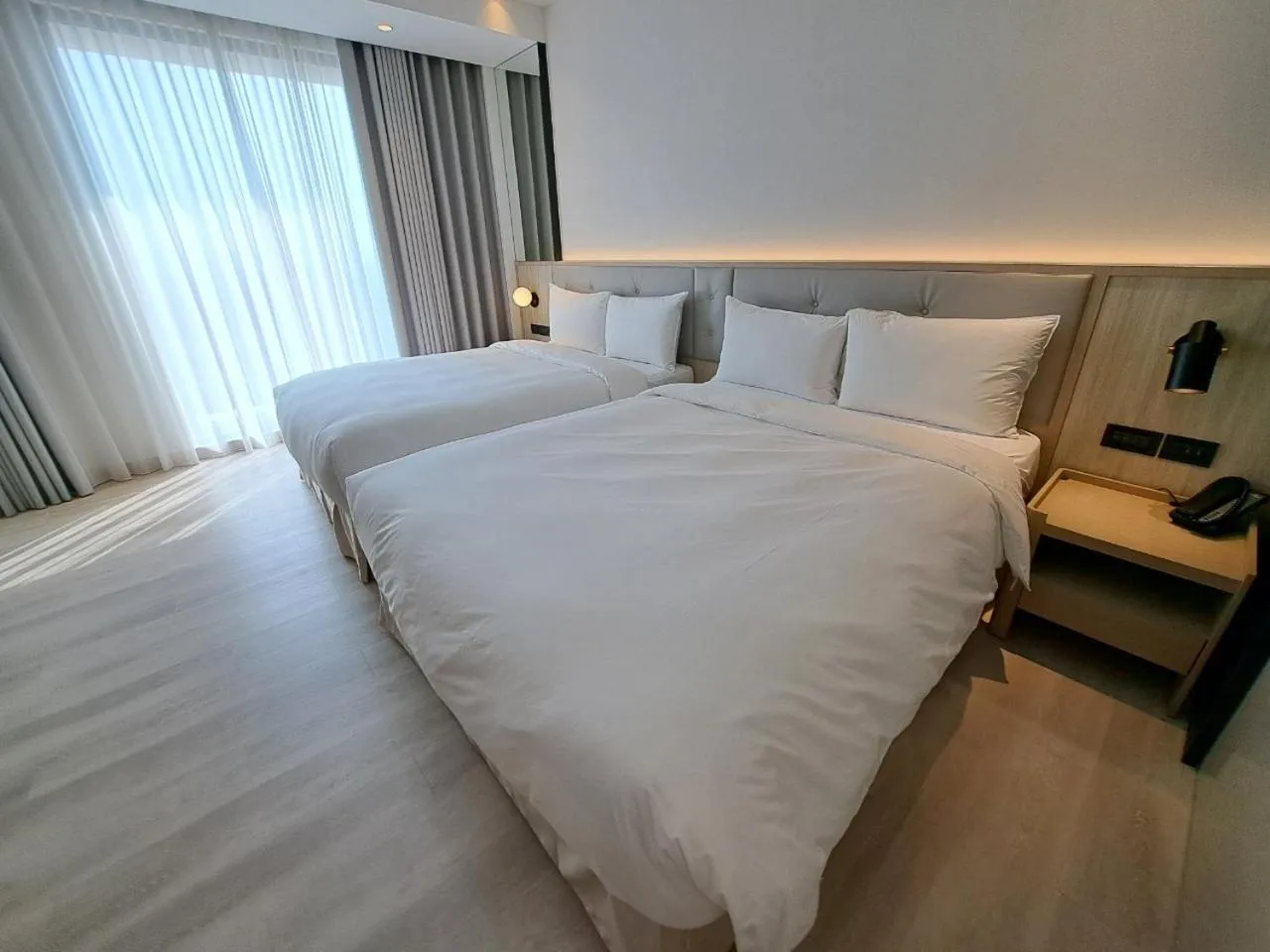 Bed in Boutech Wuri Village Hotel