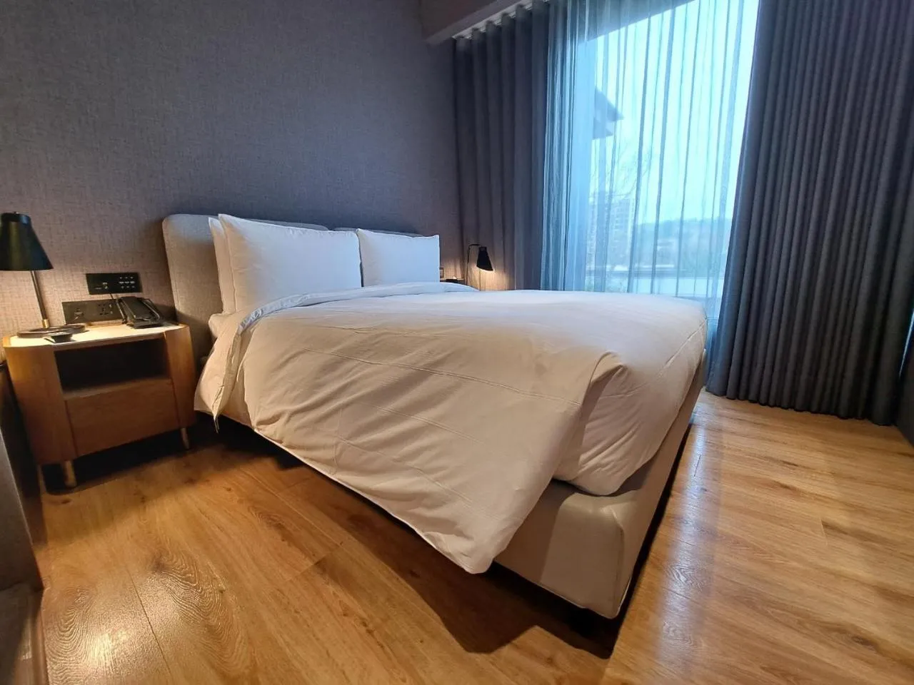 Bed in Boutech Wuri Village Hotel