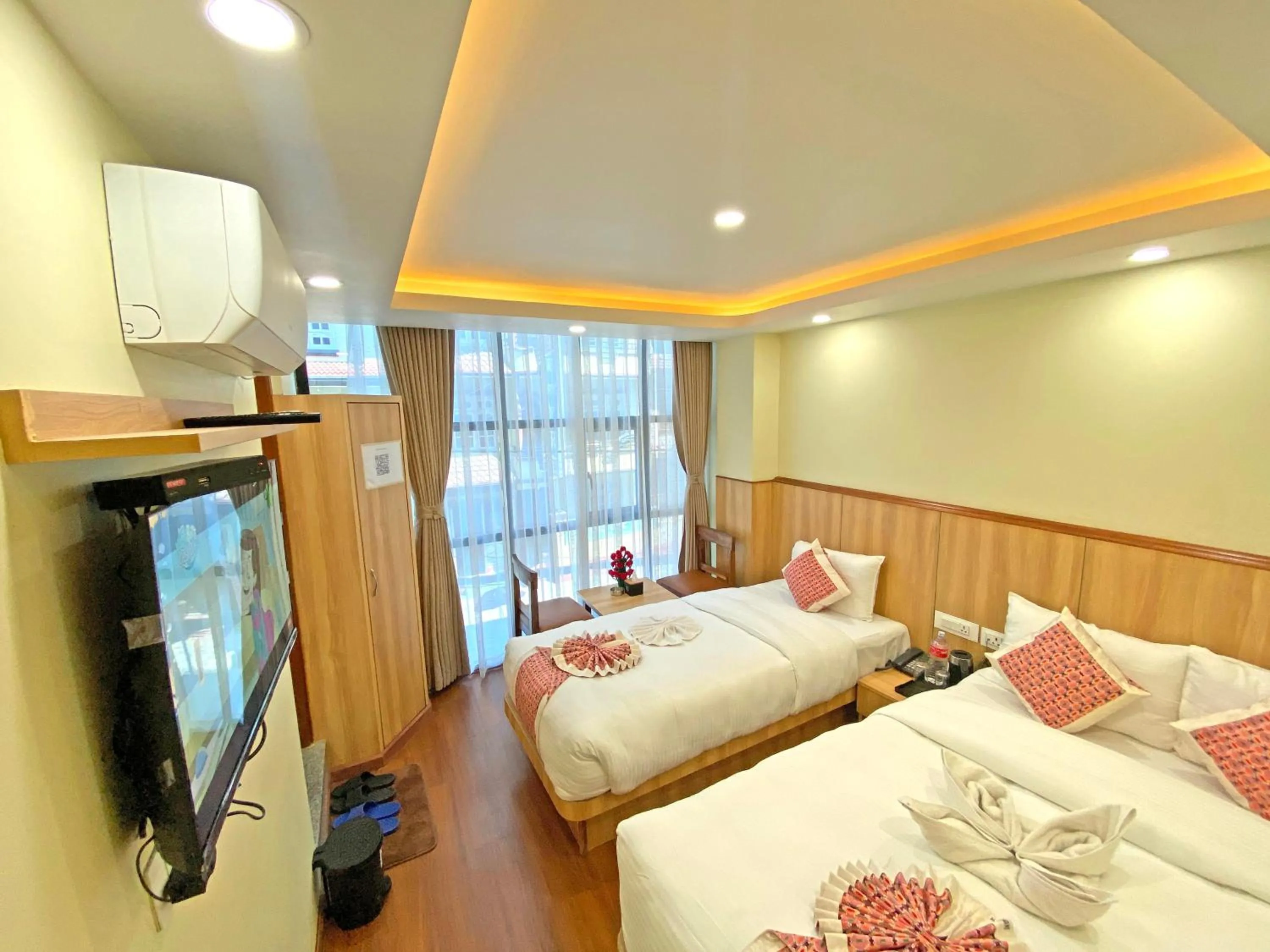 Communal lounge/ TV room, Bed in Hotel Lumbini Airport