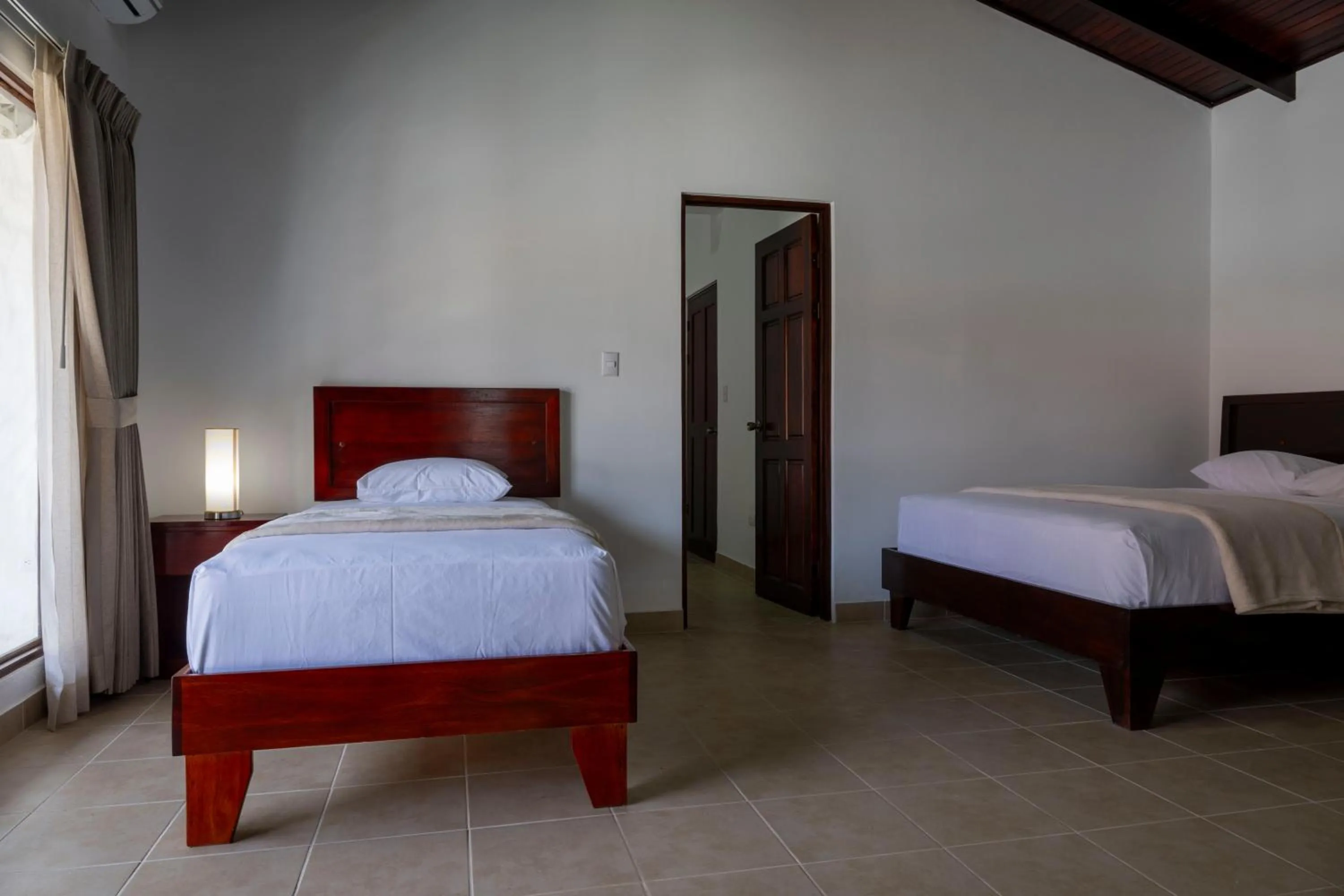 Bedroom, Bed in Fuego del Sol Beachfront Hotel