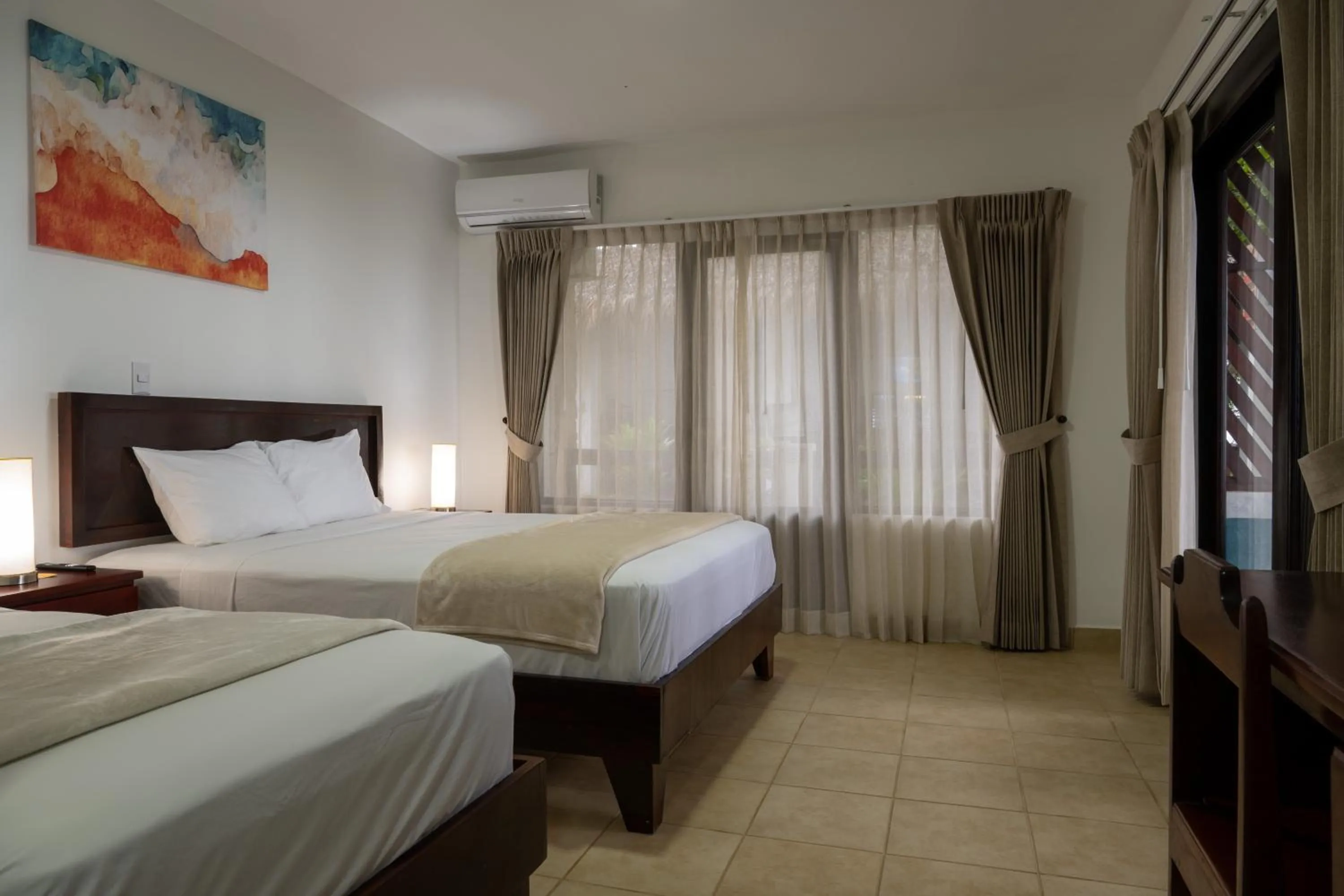 Bed in Fuego del Sol Beachfront Hotel