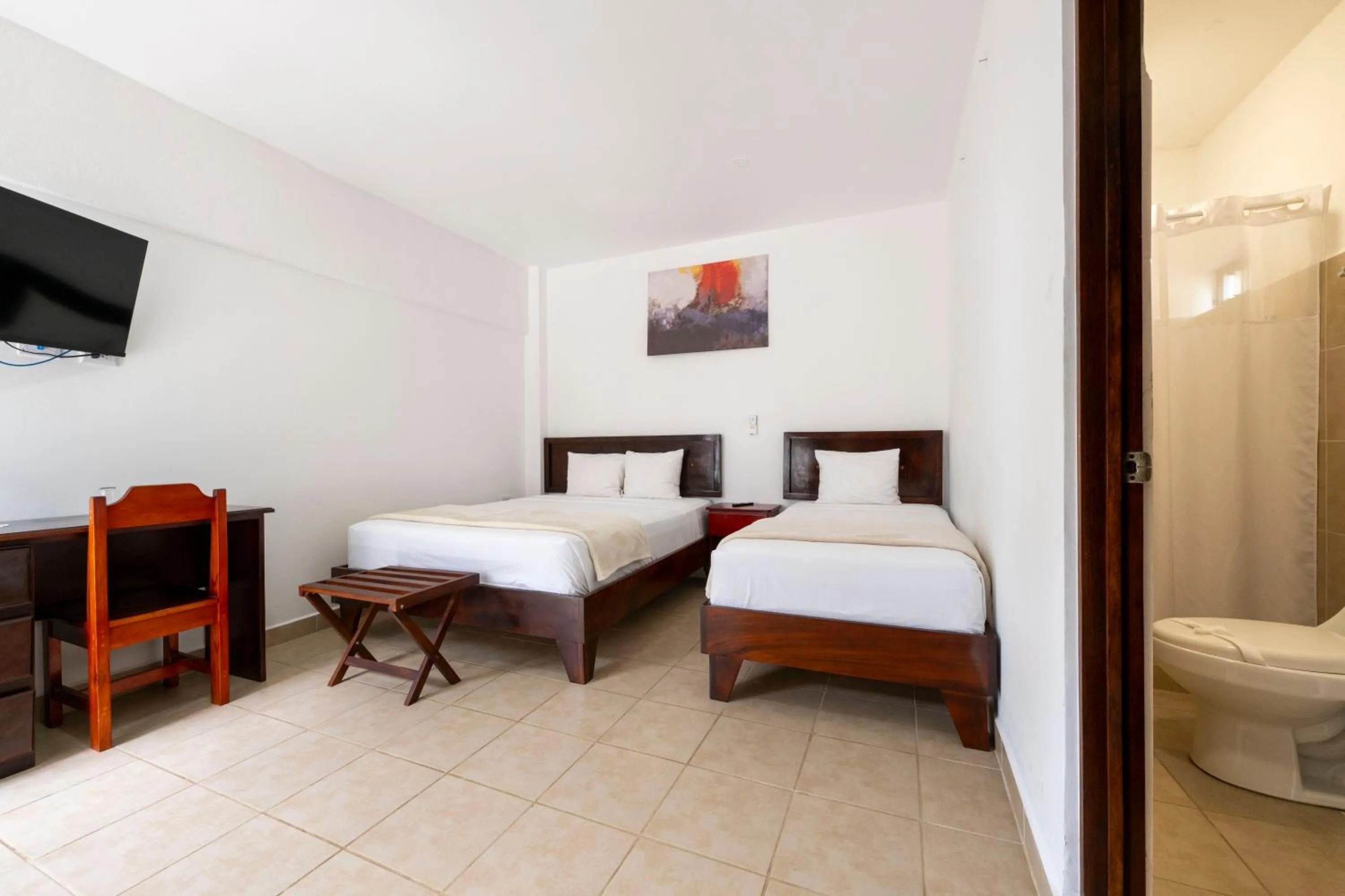 Bed in Fuego del Sol Beachfront Hotel