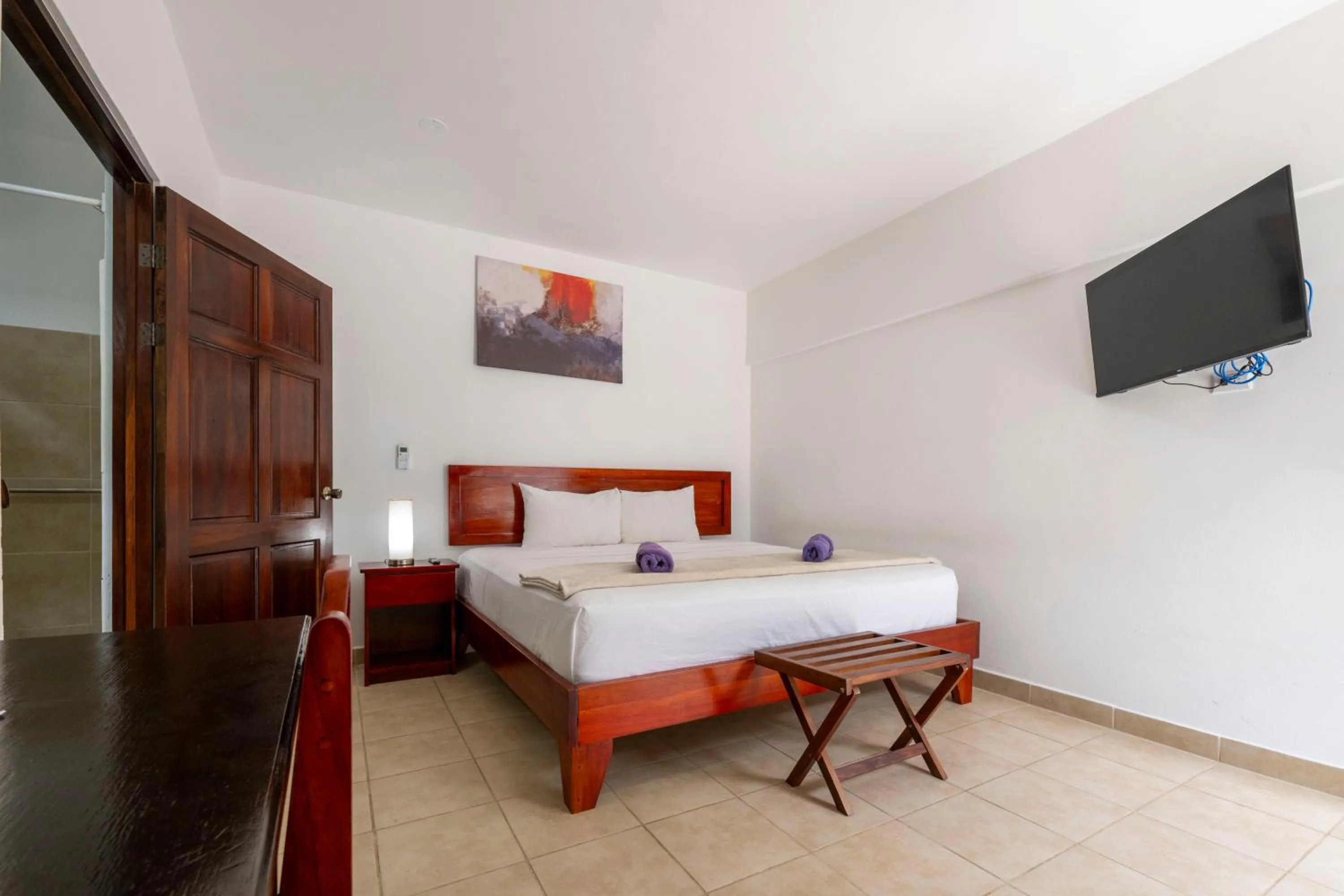 Bed in Fuego del Sol Beachfront Hotel