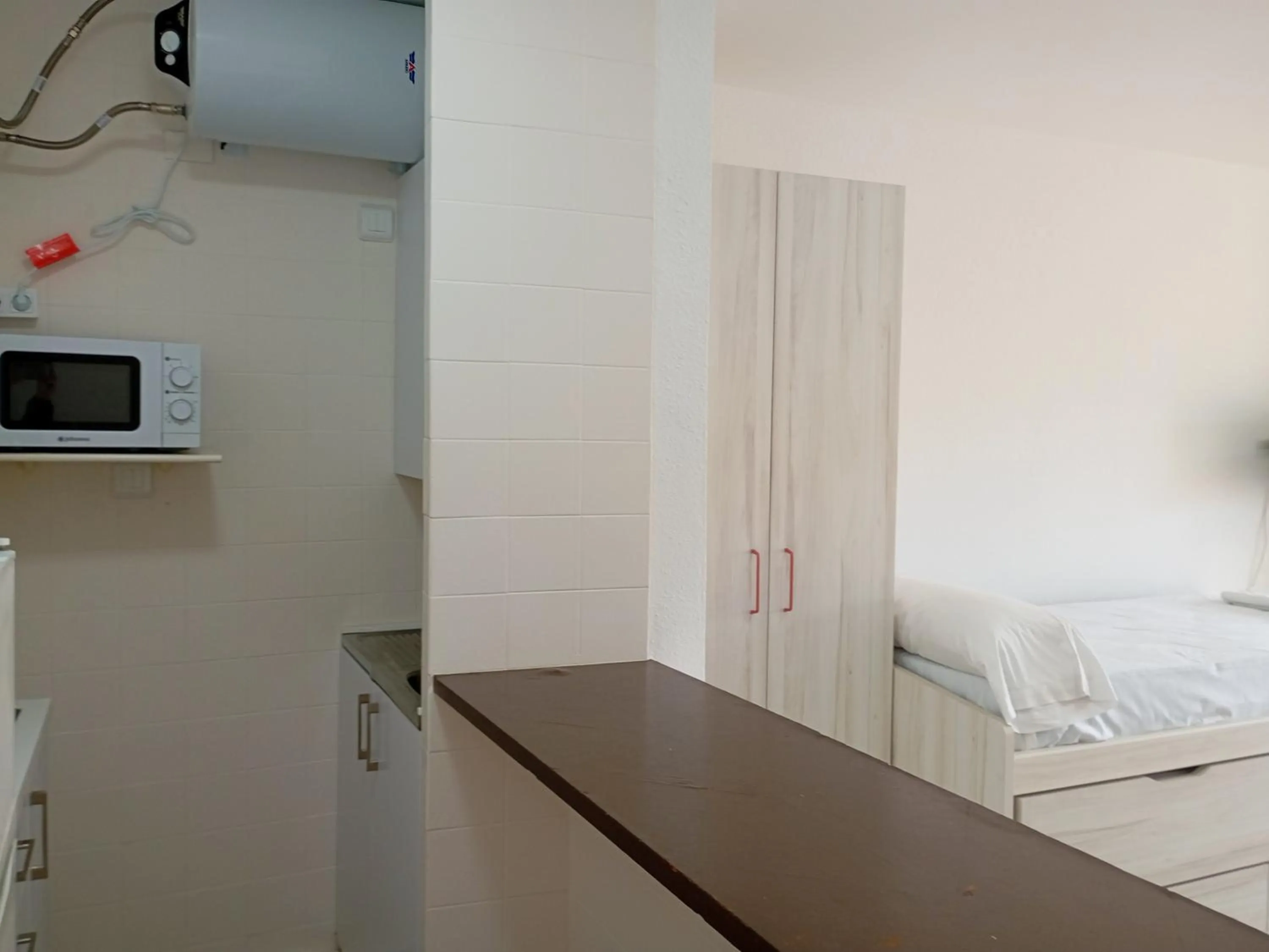 Kitchen or kitchenette, Bed in Apartamentos Voramar Peñíscola 3000