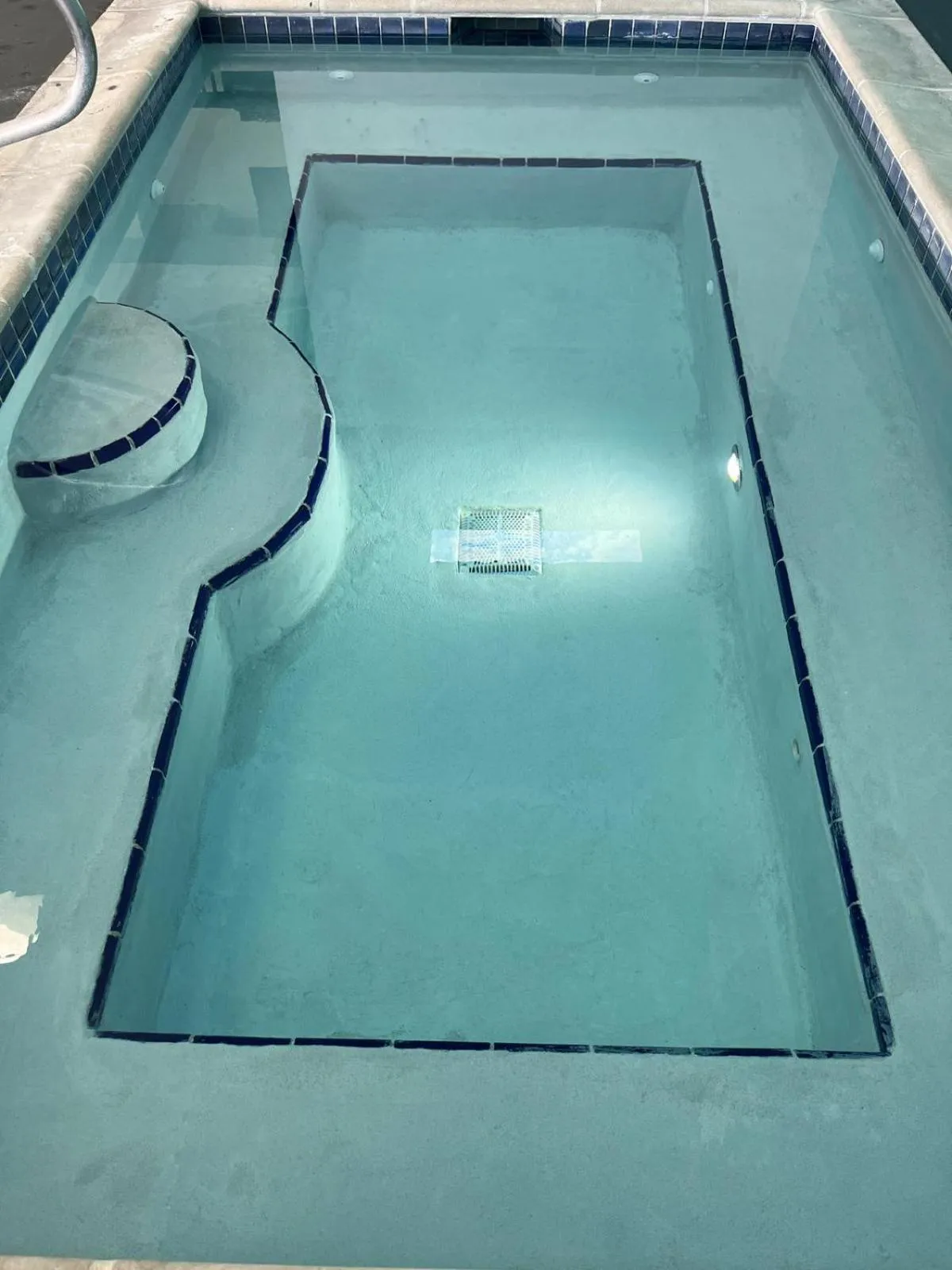 Swimming pool in Alliance Hotel & Suites, a Howard Johnson by Wyndham