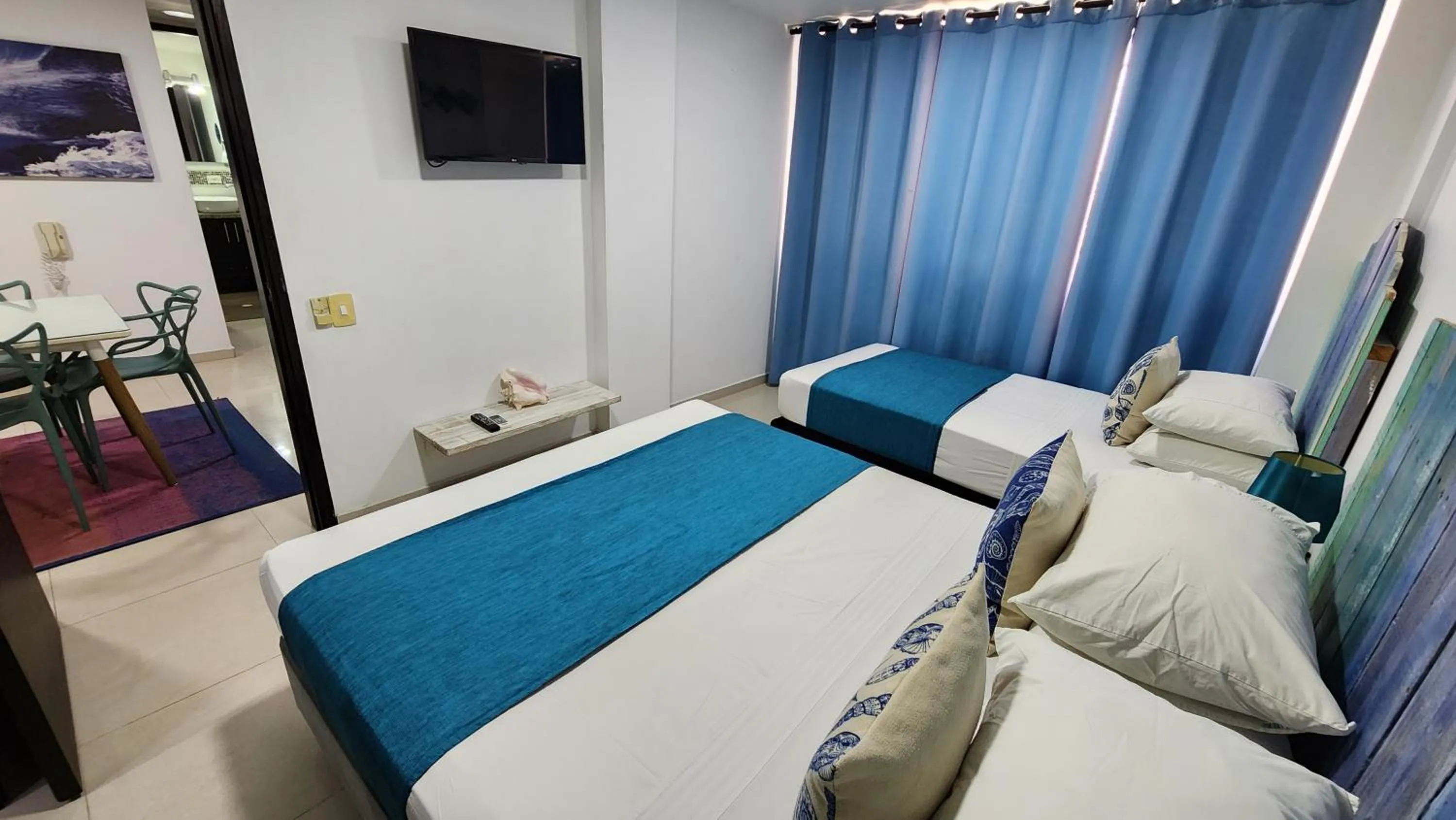 Bed in White Coral ApartaSuites