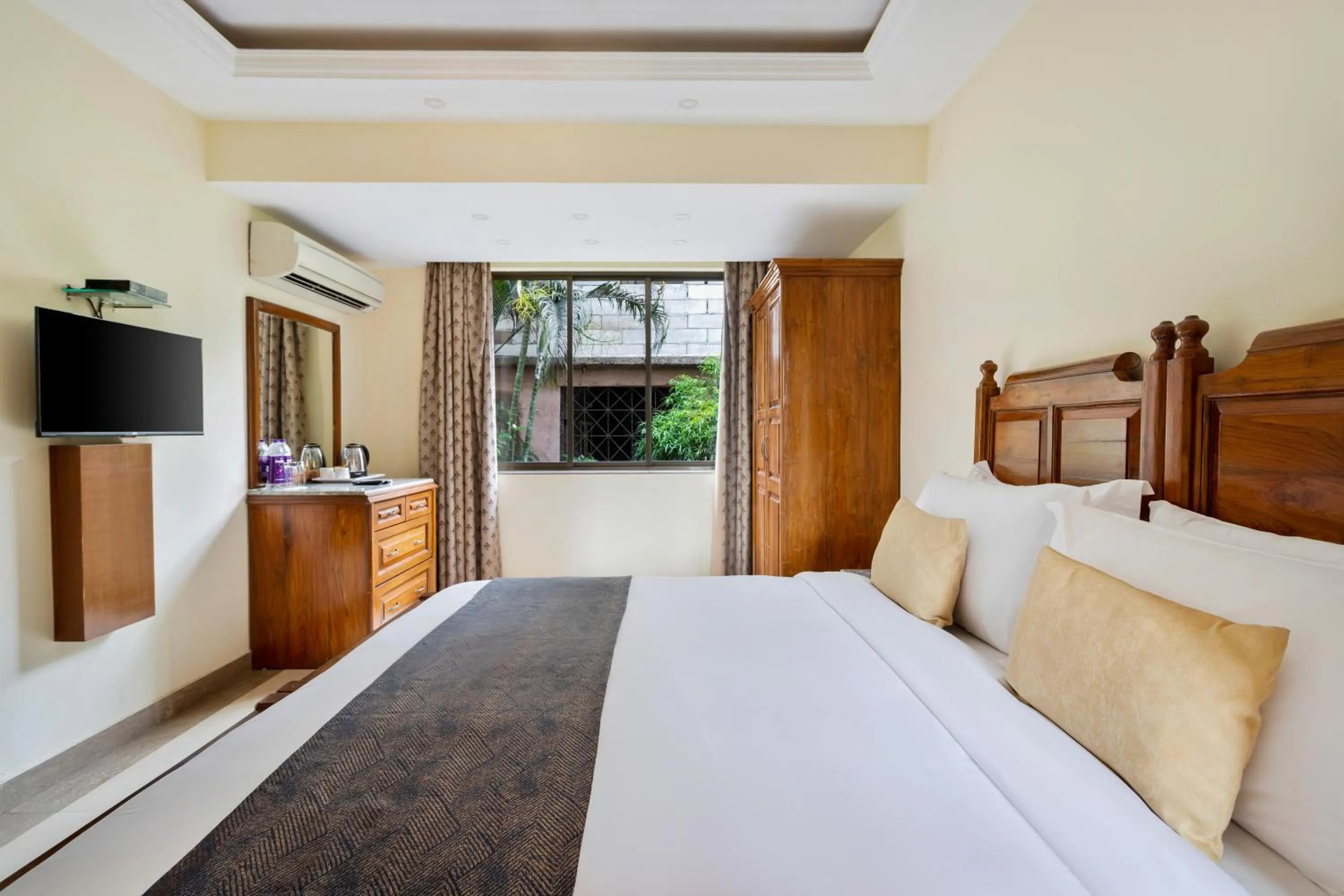 View (from property/room), Bed in De Mandarin Beach Resort Suites & Villas, Candolim