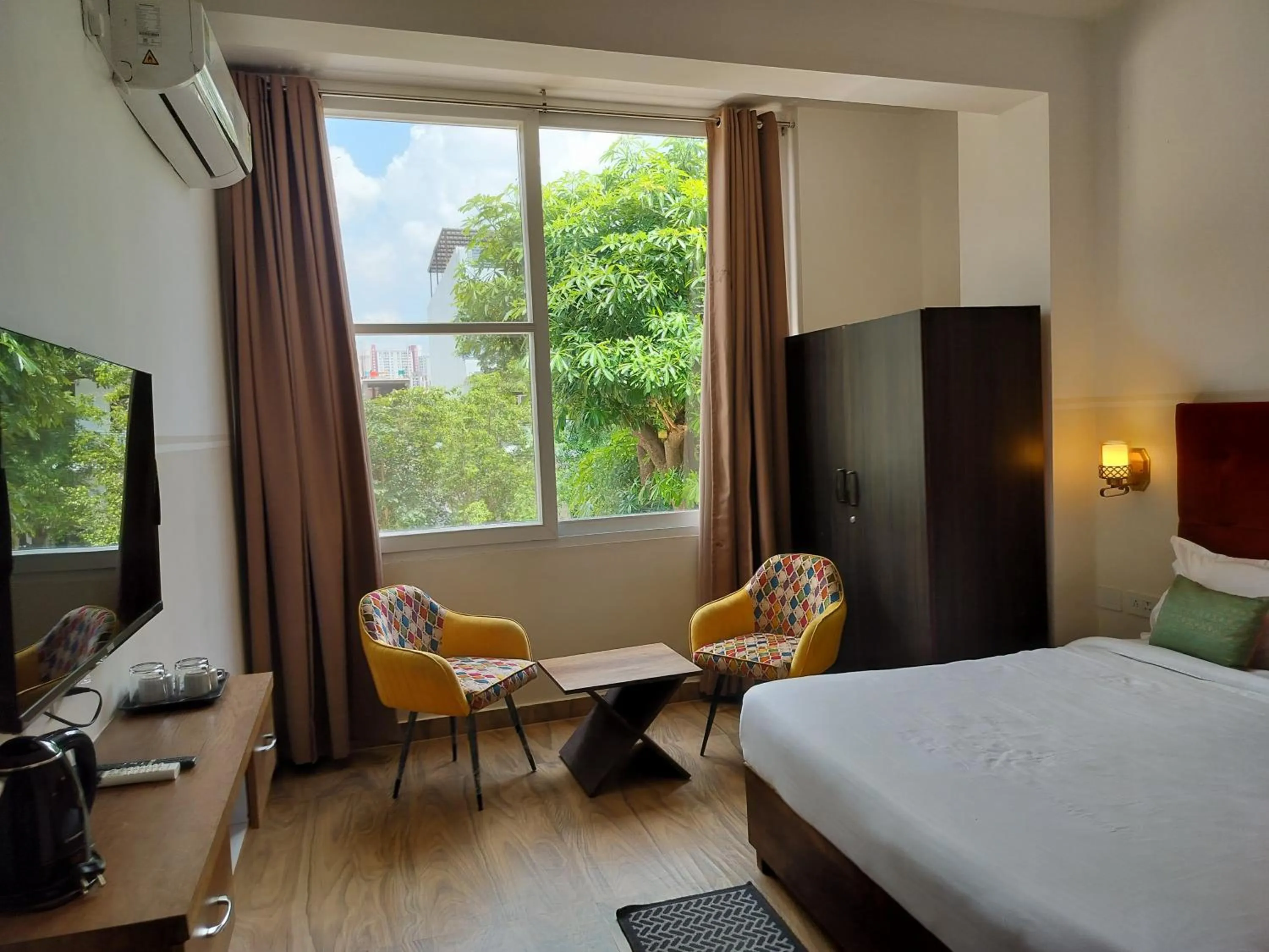 Bedroom, Bed in Saffron Inn - Expo India Mart