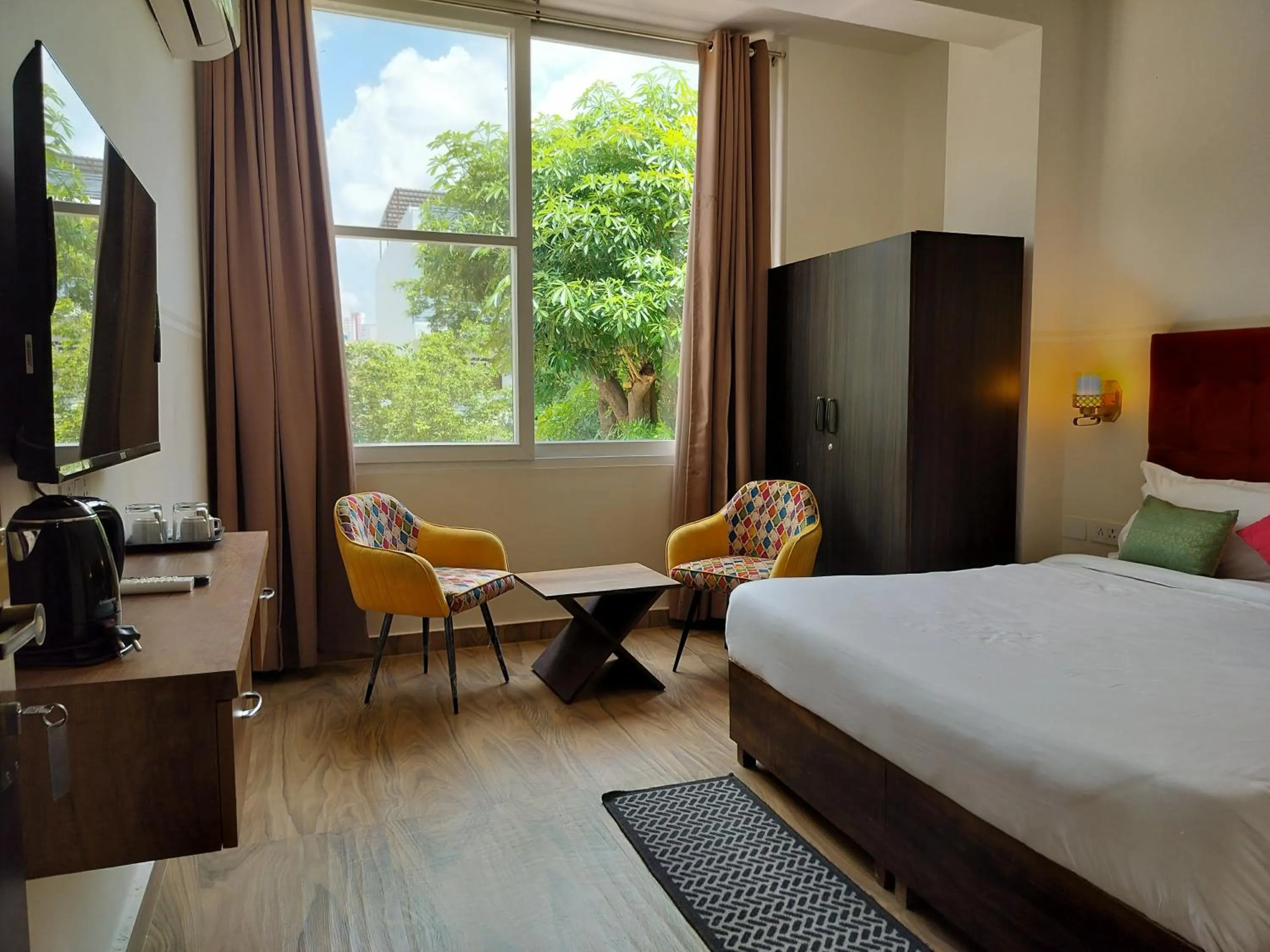 Bedroom, Bed in Saffron Inn - Expo India Mart