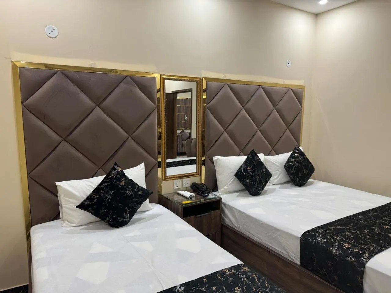 Bed in Gold Pine Hotel Lahore