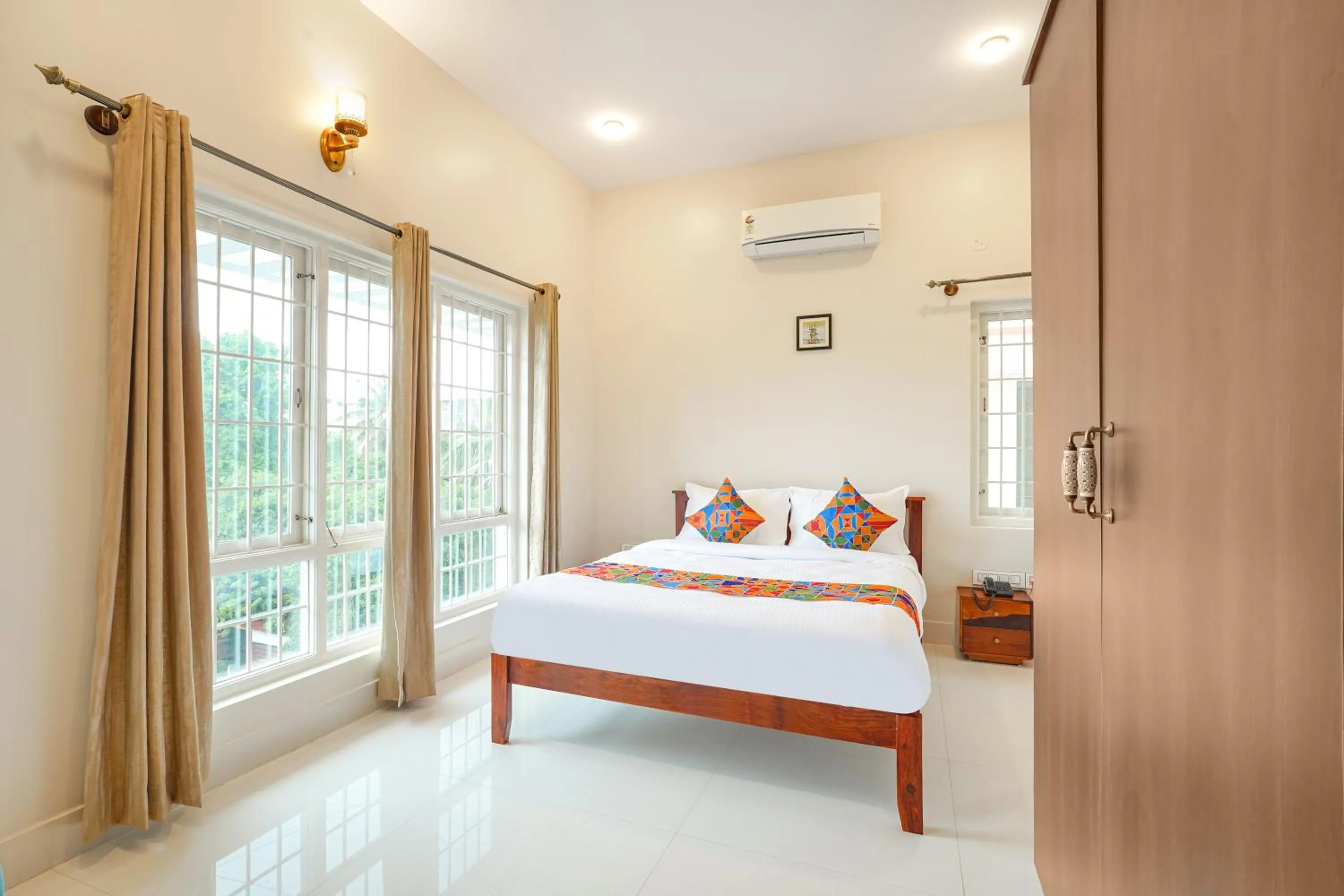 Bed in FabHotel Bougainvillea Suites - Horamavu
