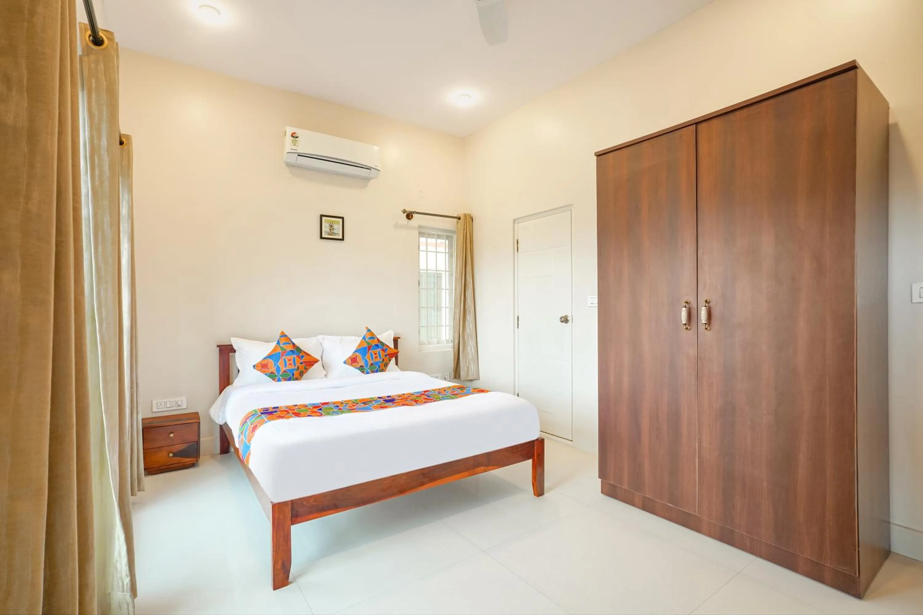 Bed in FabHotel Bougainvillea Suites - Horamavu