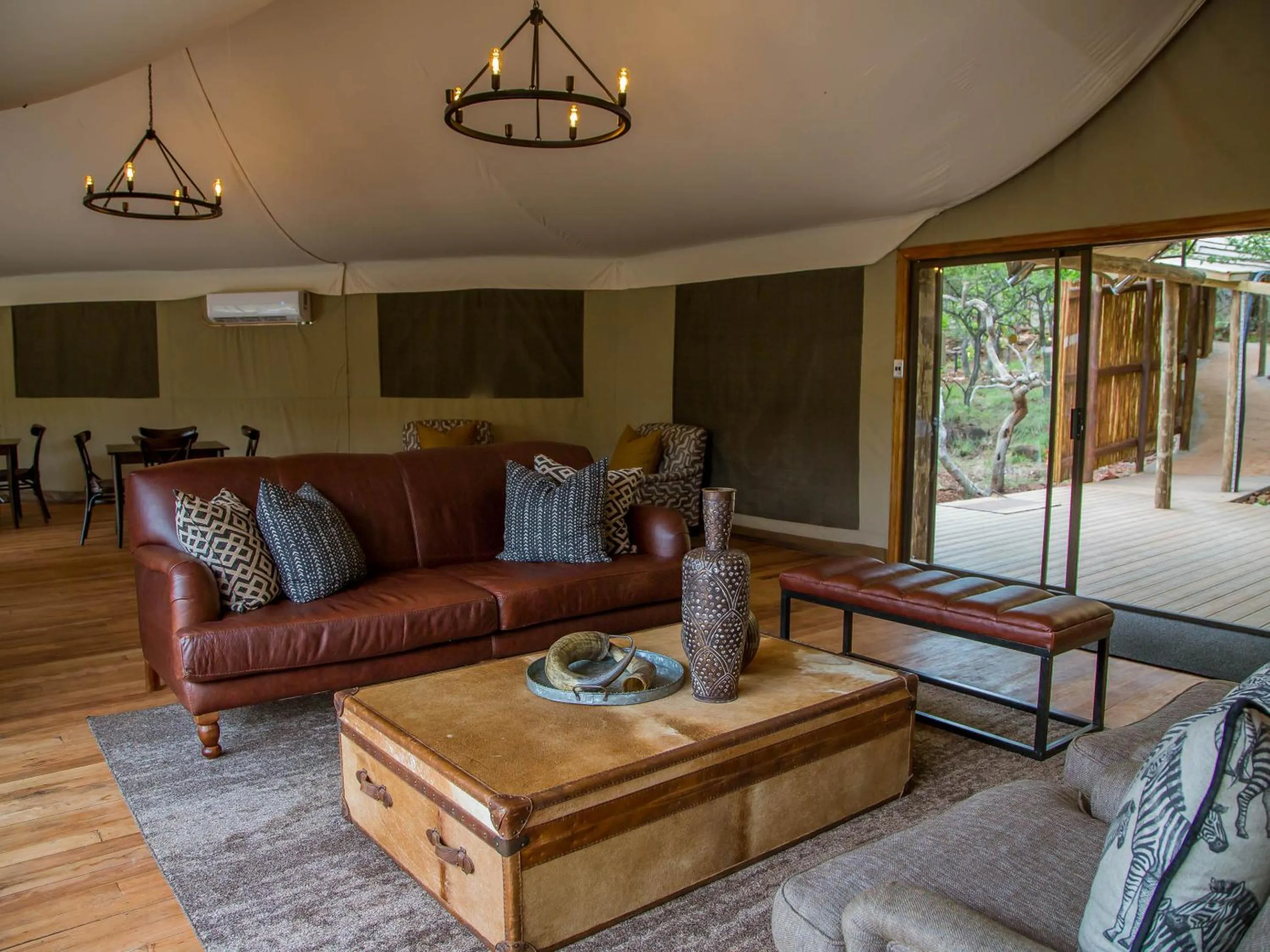 Communal lounge/ TV room in Nkomazi Game Reserve by NEWMARK