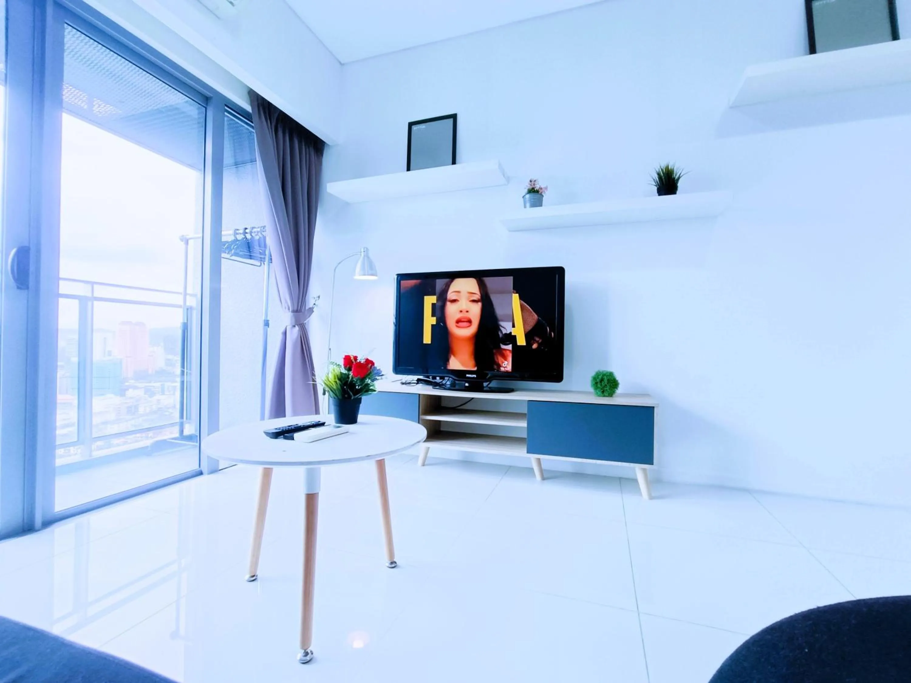 Communal lounge/ TV room in Summer Suites KLCC by Luna KL