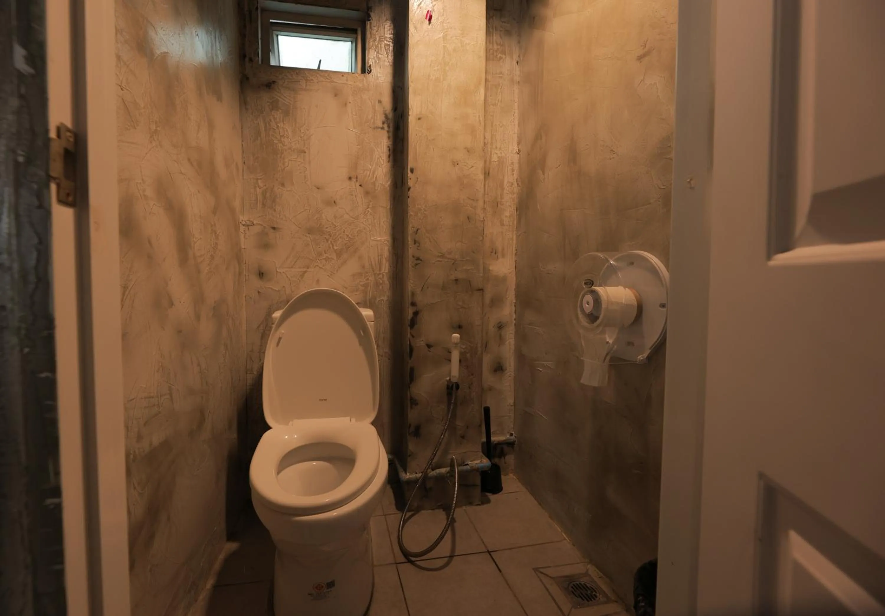 Toilet in Bud Brew Beyond Dispensary and Hotel