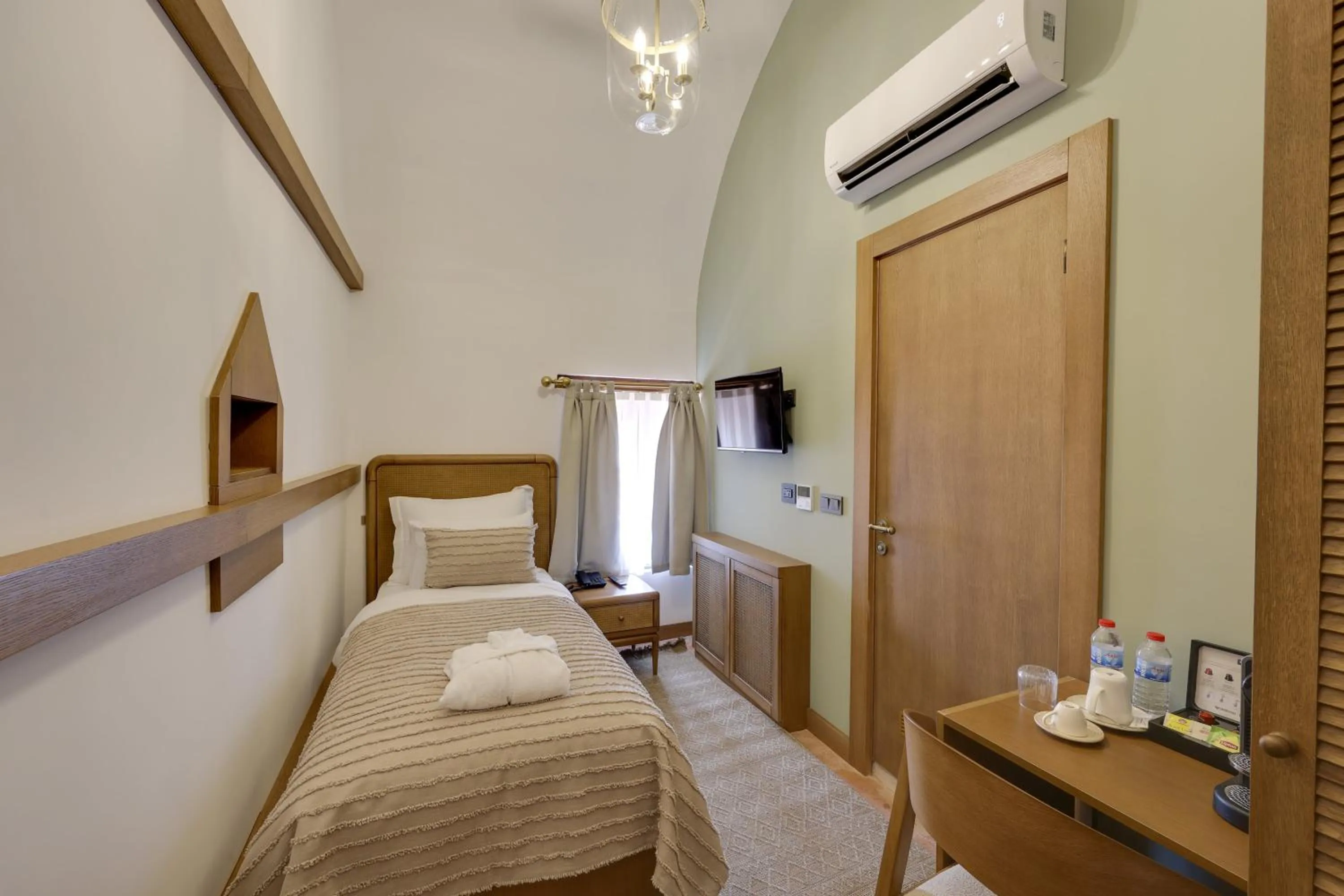 Bed in Silk Road Museum Hotel