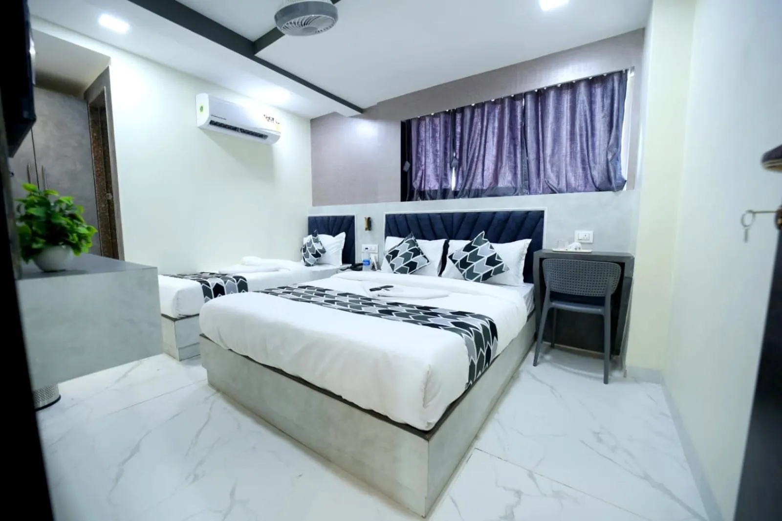 Photo of the whole room, Bed in N.M. Hotel