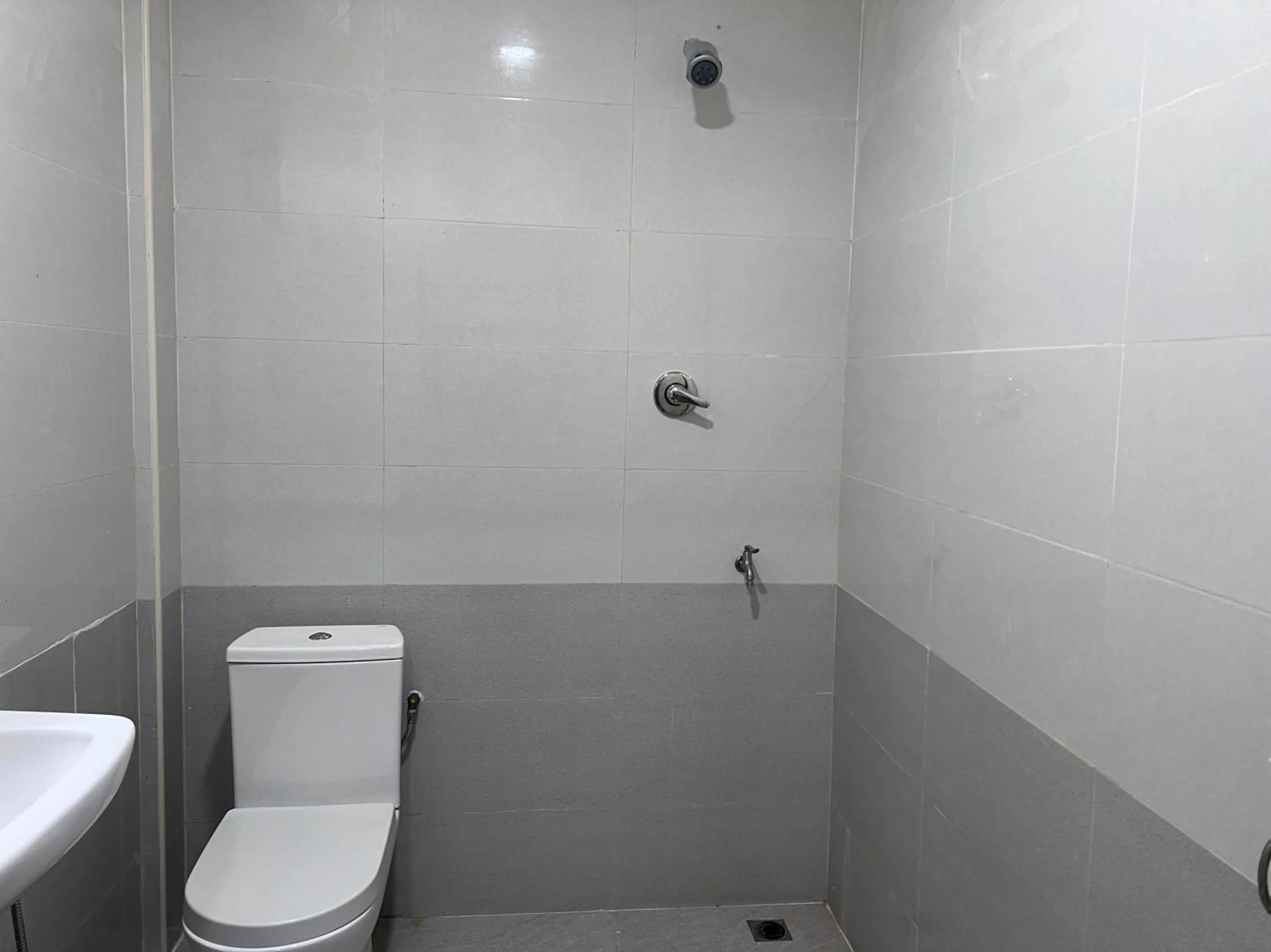 Bathroom in Hotel O Sri Ayu Inn