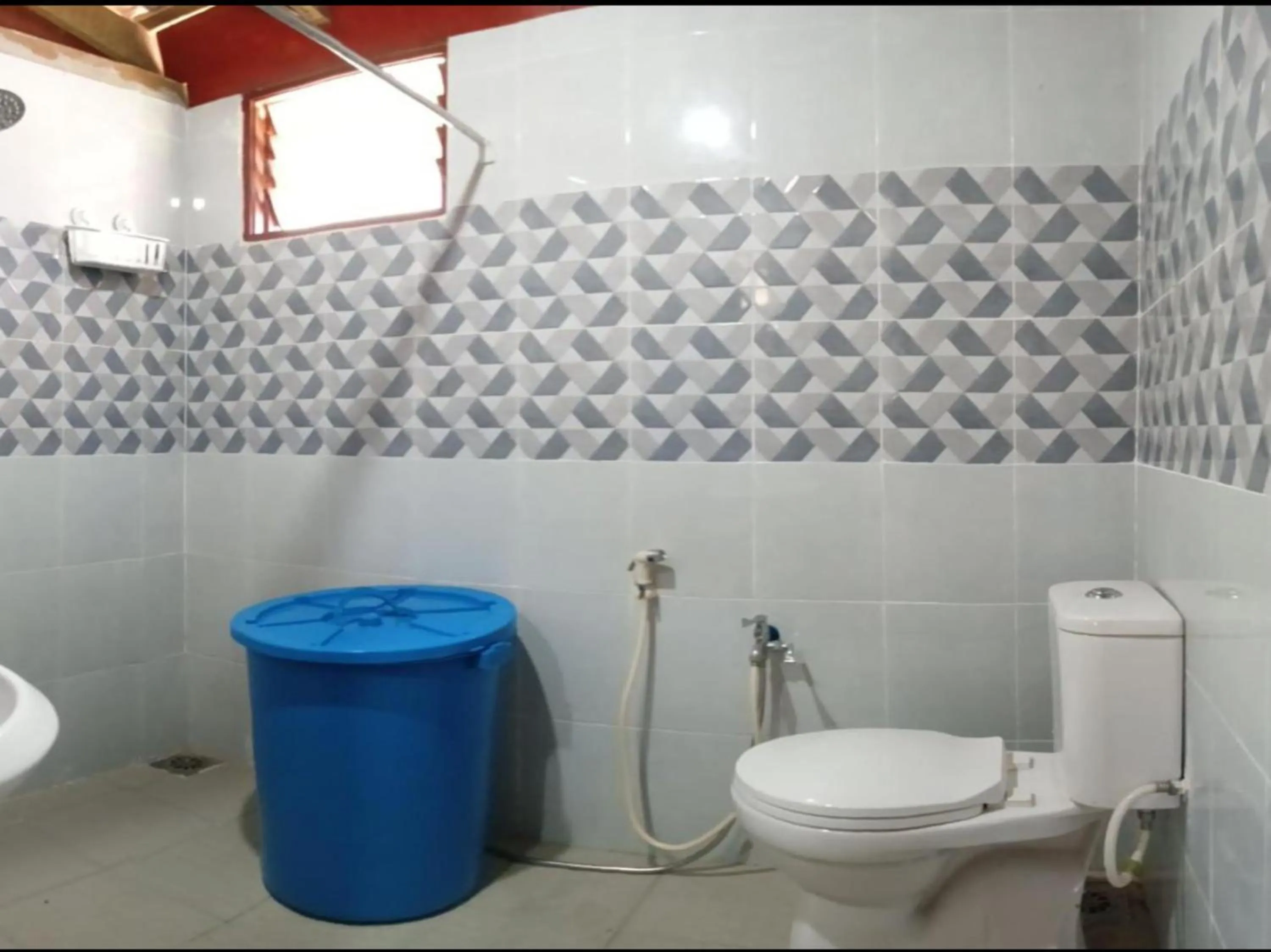 Bathroom in Hotel O Sri Ayu Inn