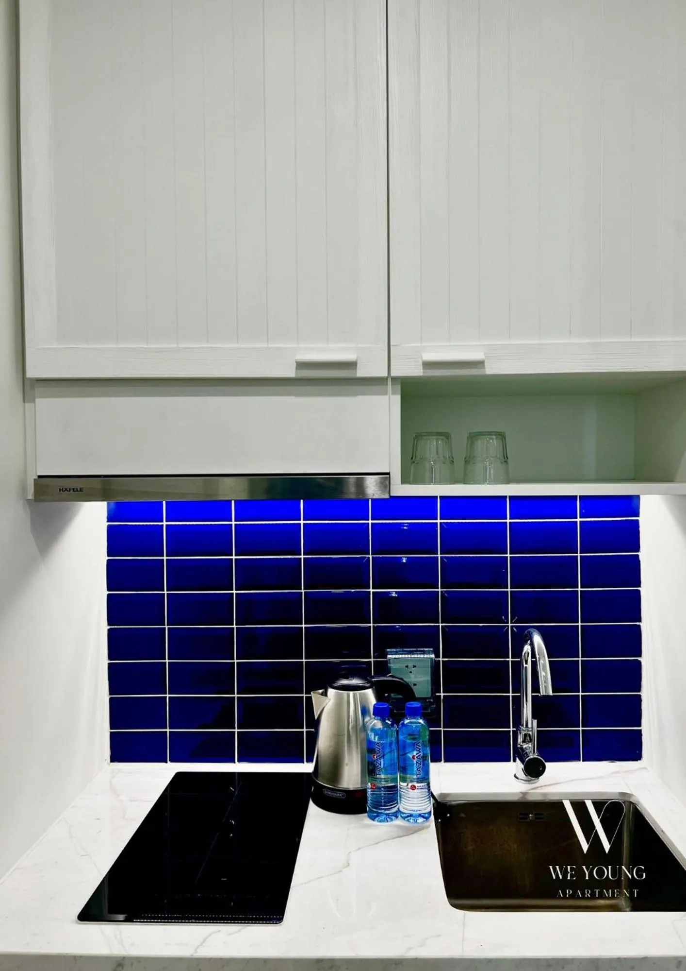 stove in We Young Apartments by HOFs - Fireworks & Ocean view