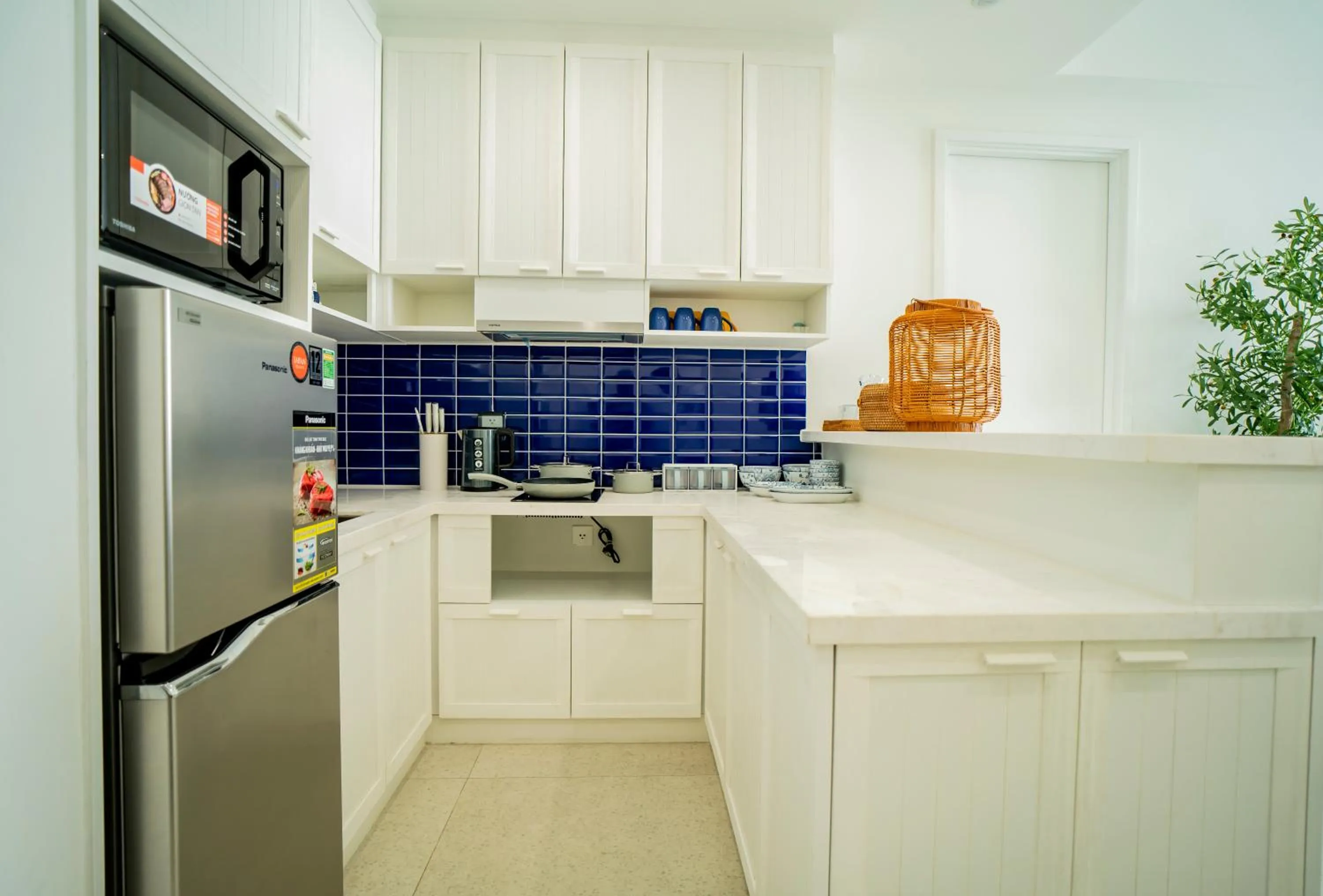 stove in We Young Apartments by HOFs - Fireworks & Ocean view