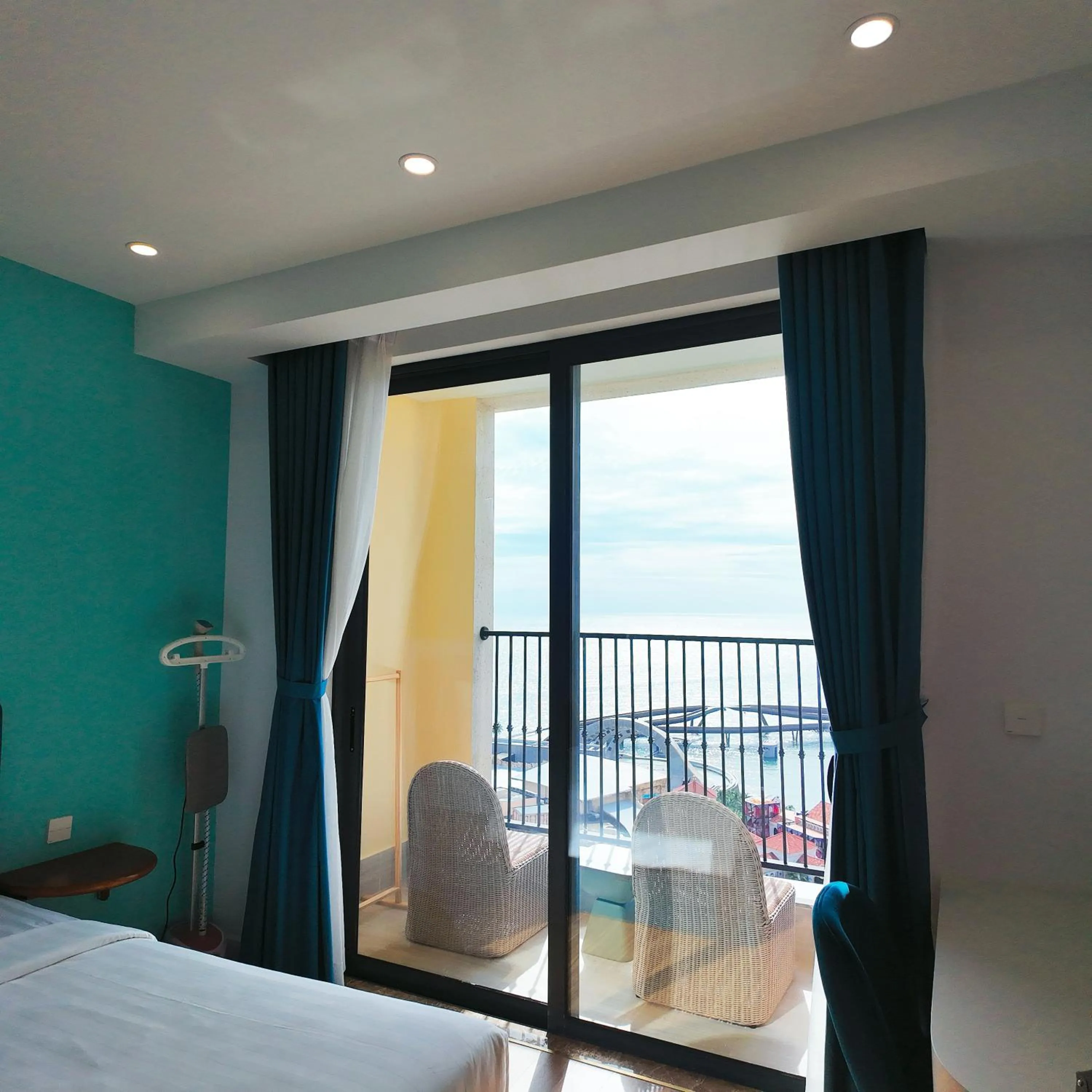 Bedroom, Bed in We Young Apartments by HOFs - Fireworks & Ocean view
