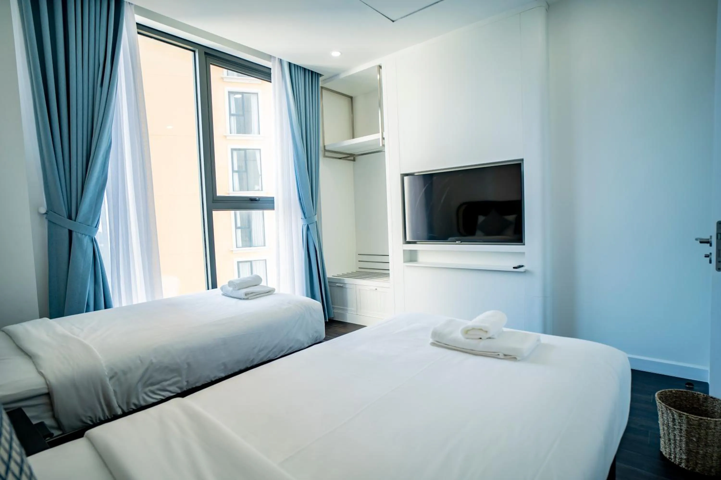 Bed in We Young Apartments by HOFs - Fireworks & Ocean view