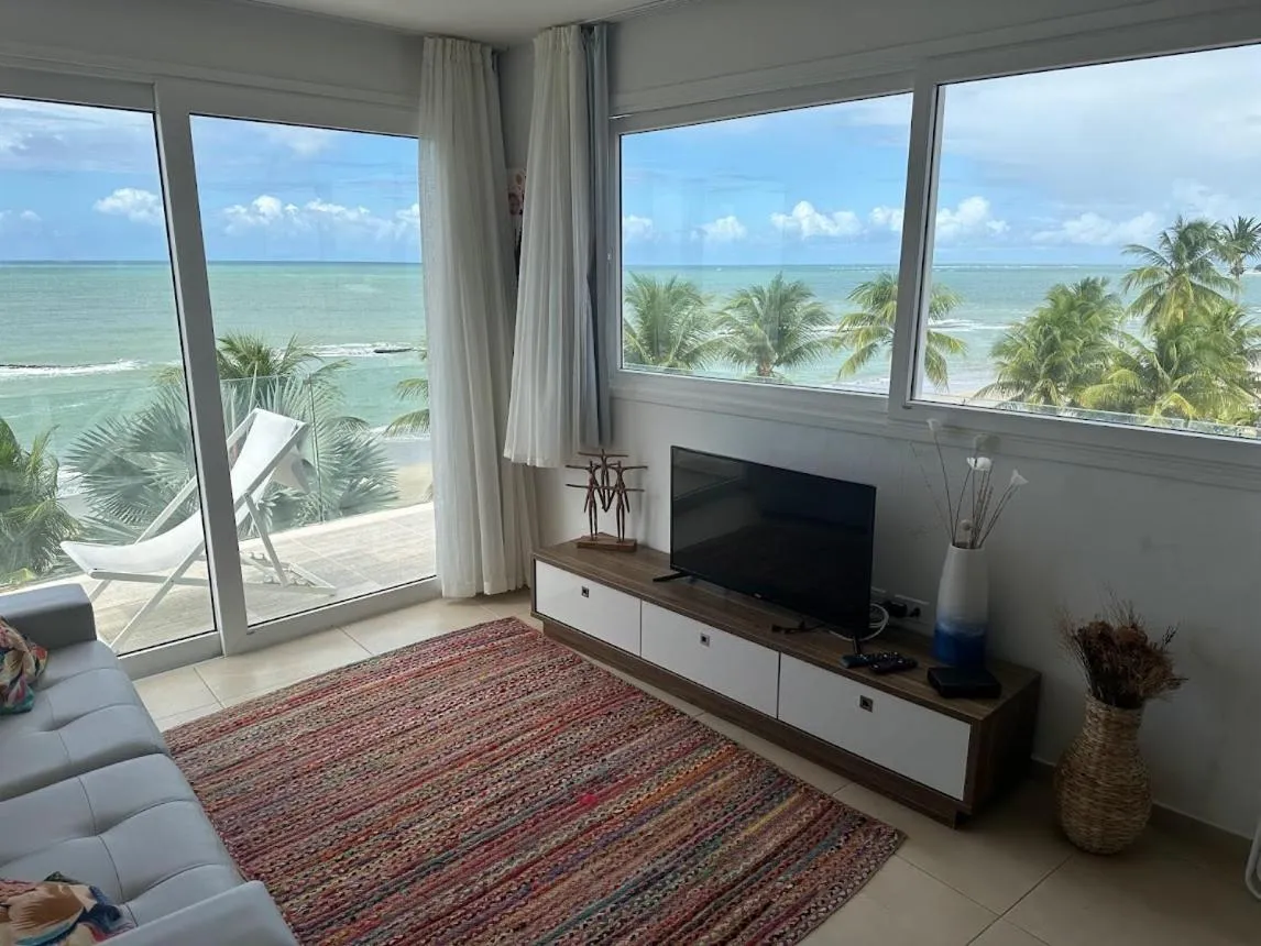 Communal lounge/ TV room in ApartHotel Praia dos Carneiros