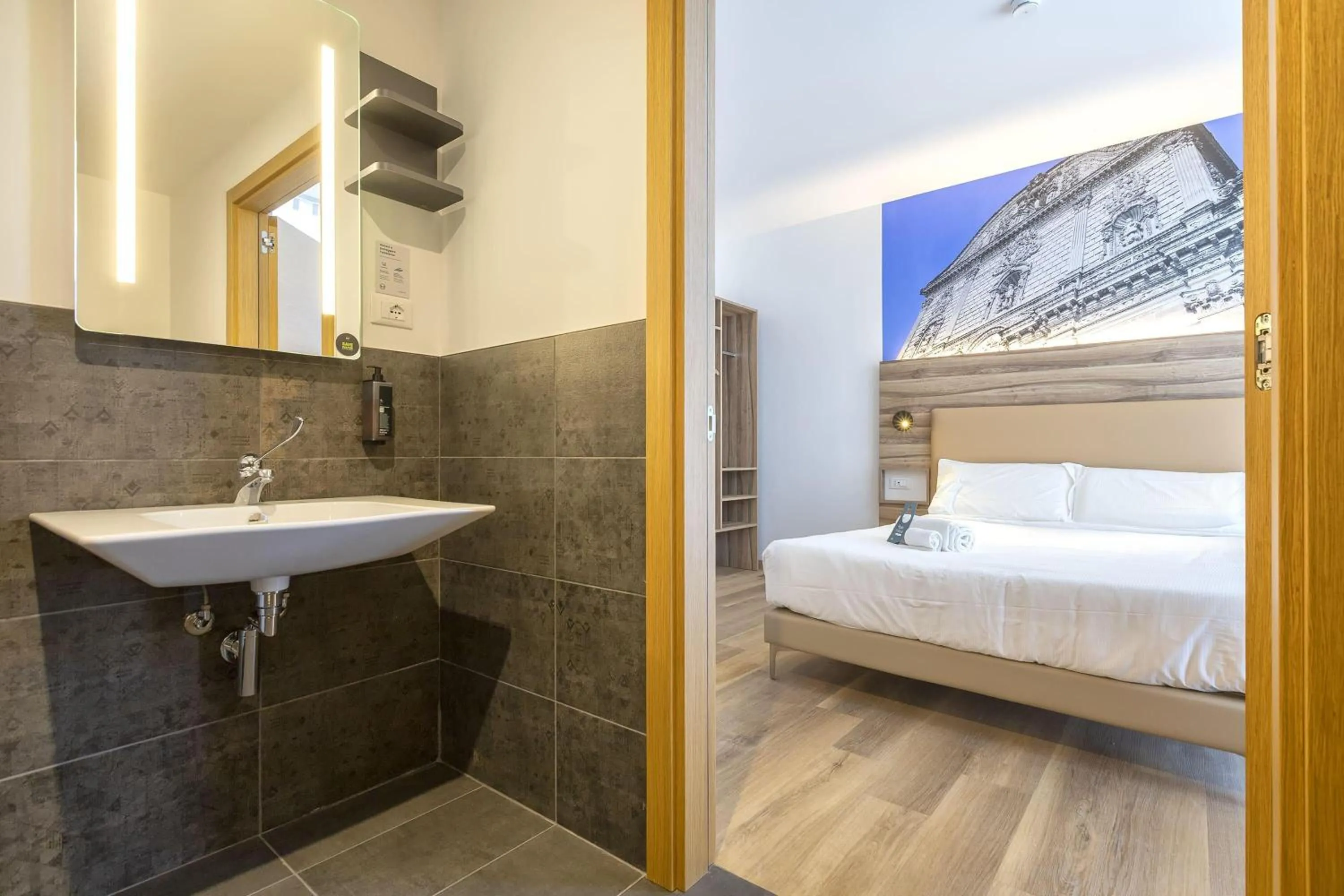 Bathroom, Bed in B&B HOTEL Sassari