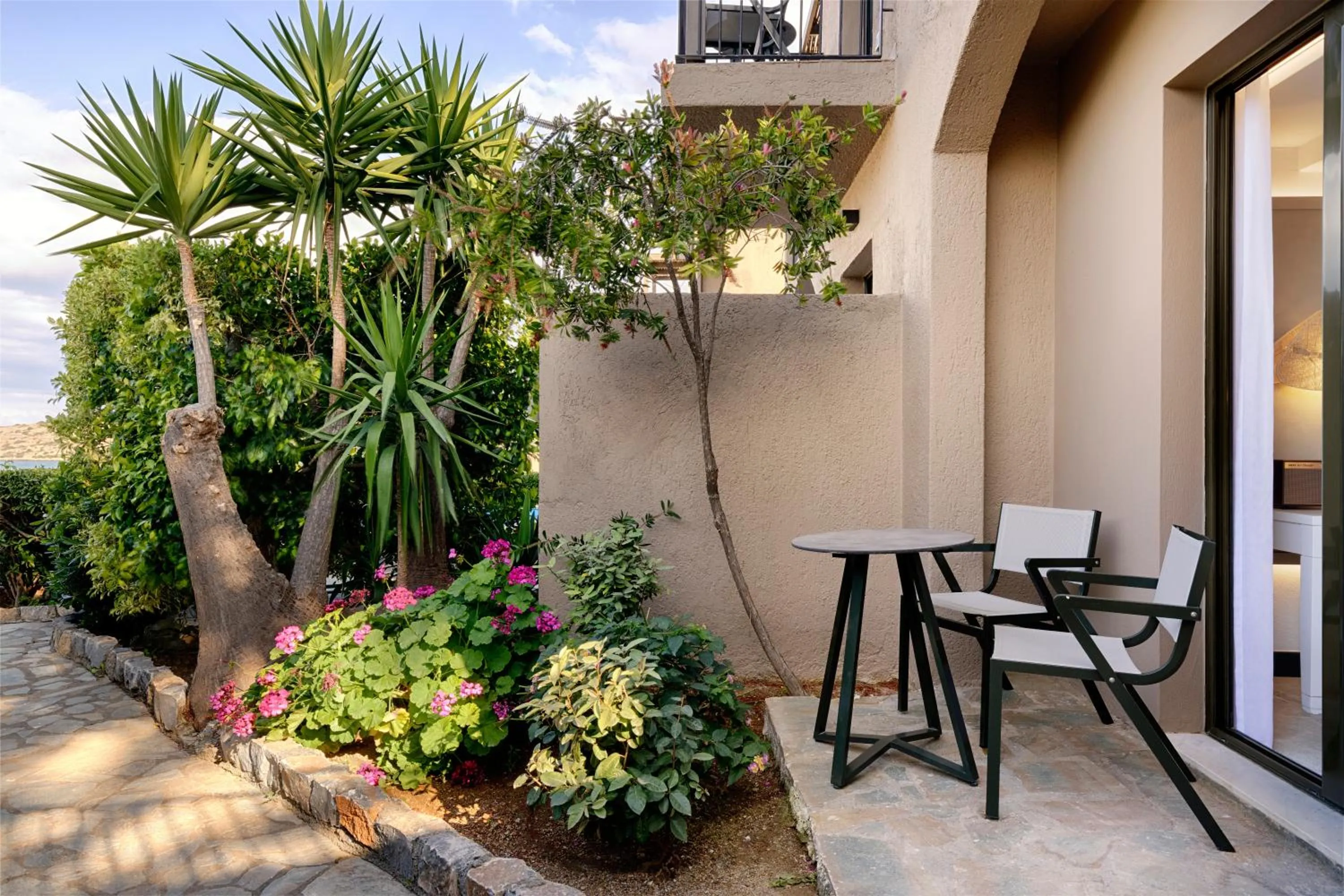 Patio in Domes Aulus Elounda All-Inclusive Resort, Adults only, Curio by Hilton