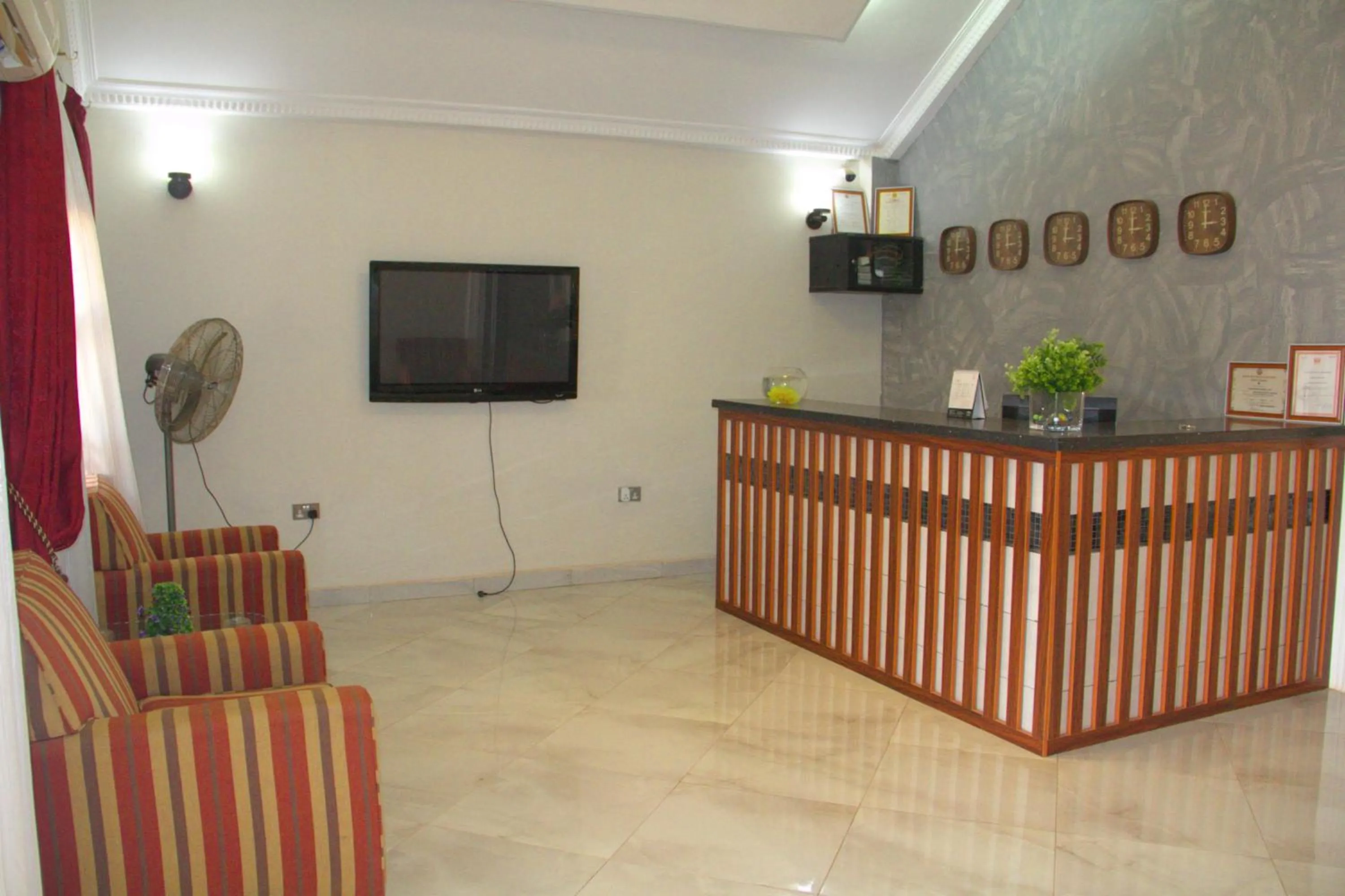 Communal lounge/ TV room in Gold Plus Hotel Ghana