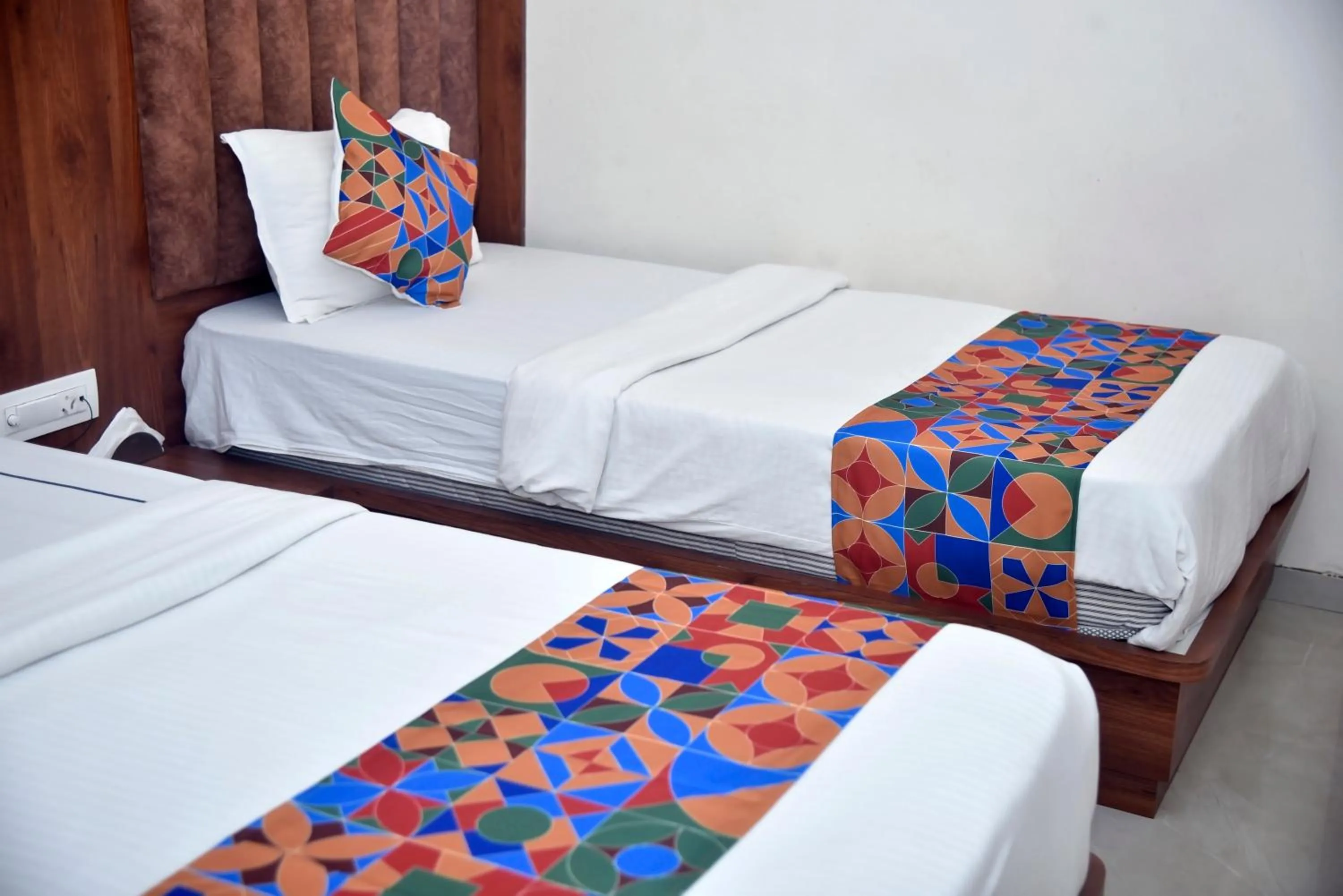 Bed in Hotel Pride Inn