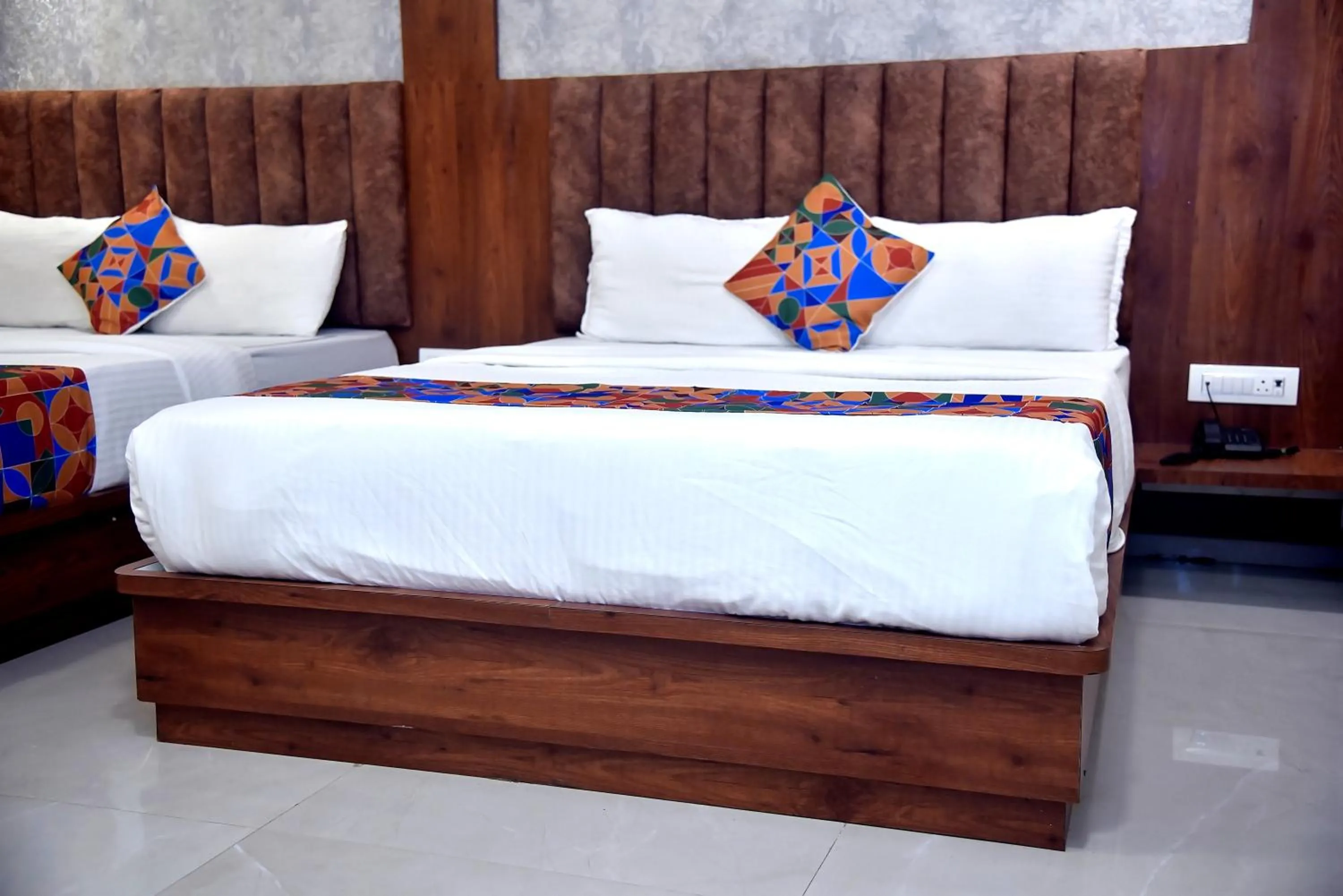 Bed in Hotel Pride Inn