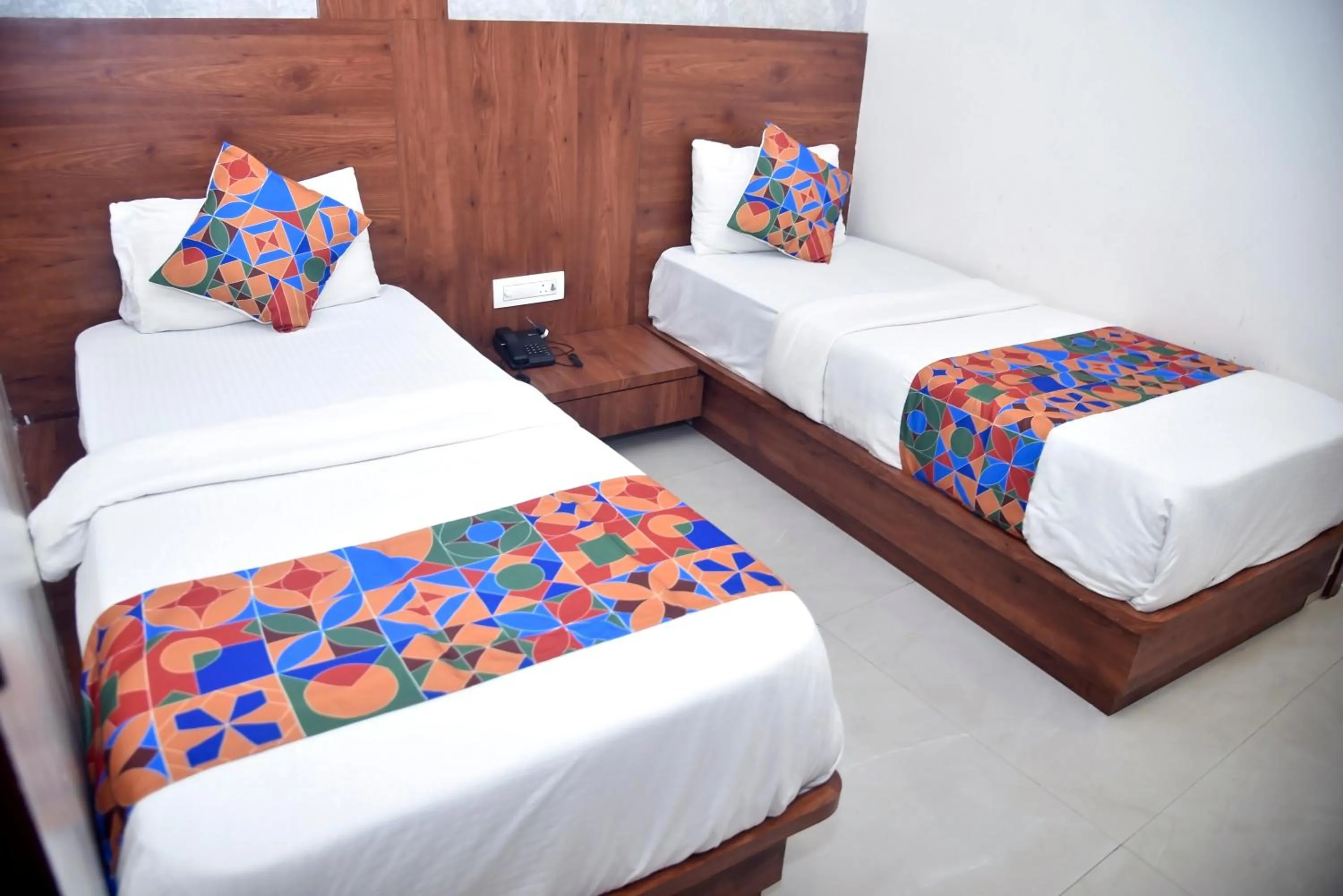 Bed in Hotel Pride Inn