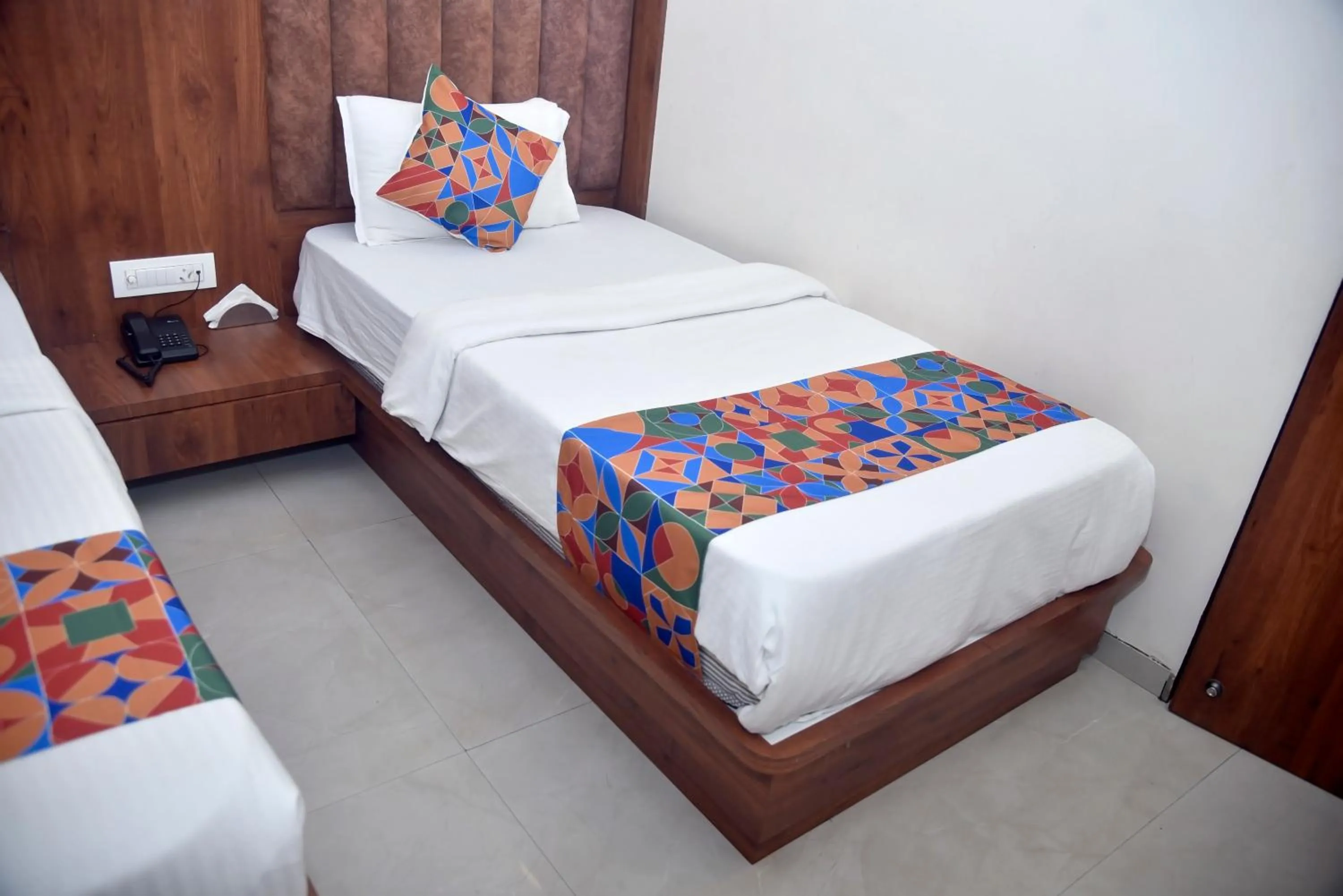 Bed in Hotel Pride Inn